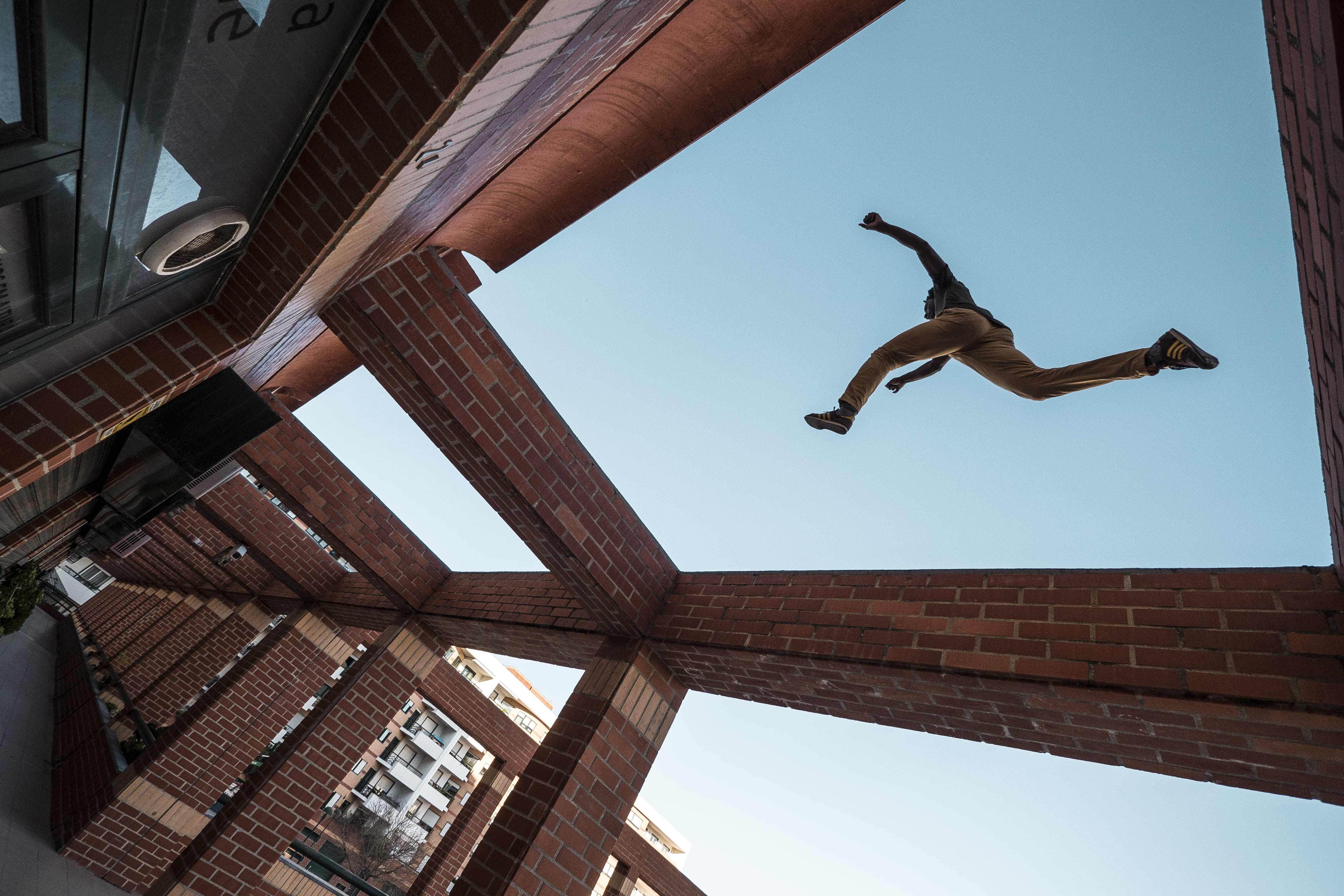 4K, real people, leap, jumping, day, adult, sky, step, built structure, recreation, full length, building, mid-air, motion, low angle view, roof, leisure activity, HD Wallpaper