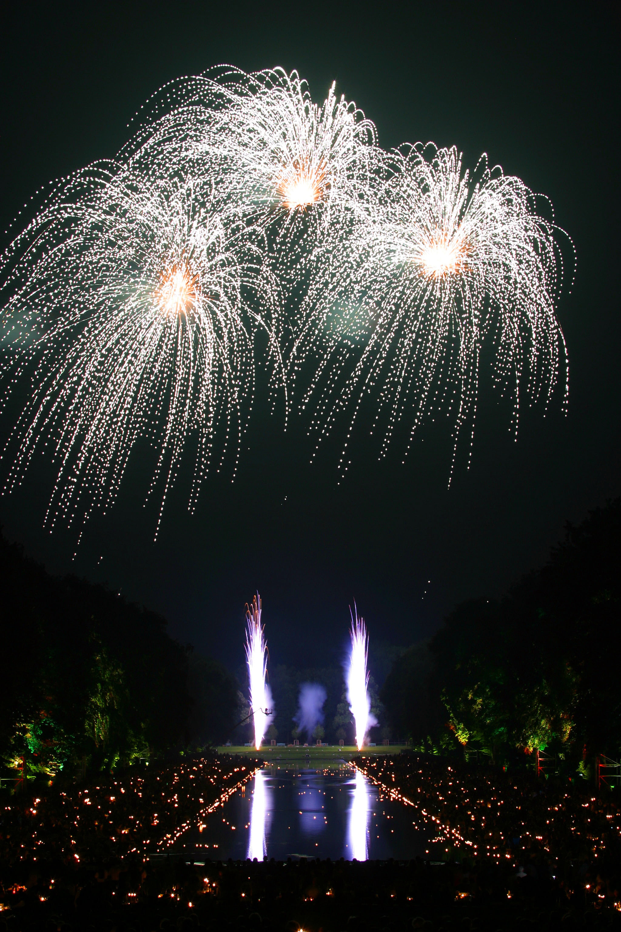 water, blurred motion, energy, fireworks, glowing, lights, illuminated, outdoors, festival, party, sparkler, luminescence, light, trees, dark, firework, Phone HD Wallpaper