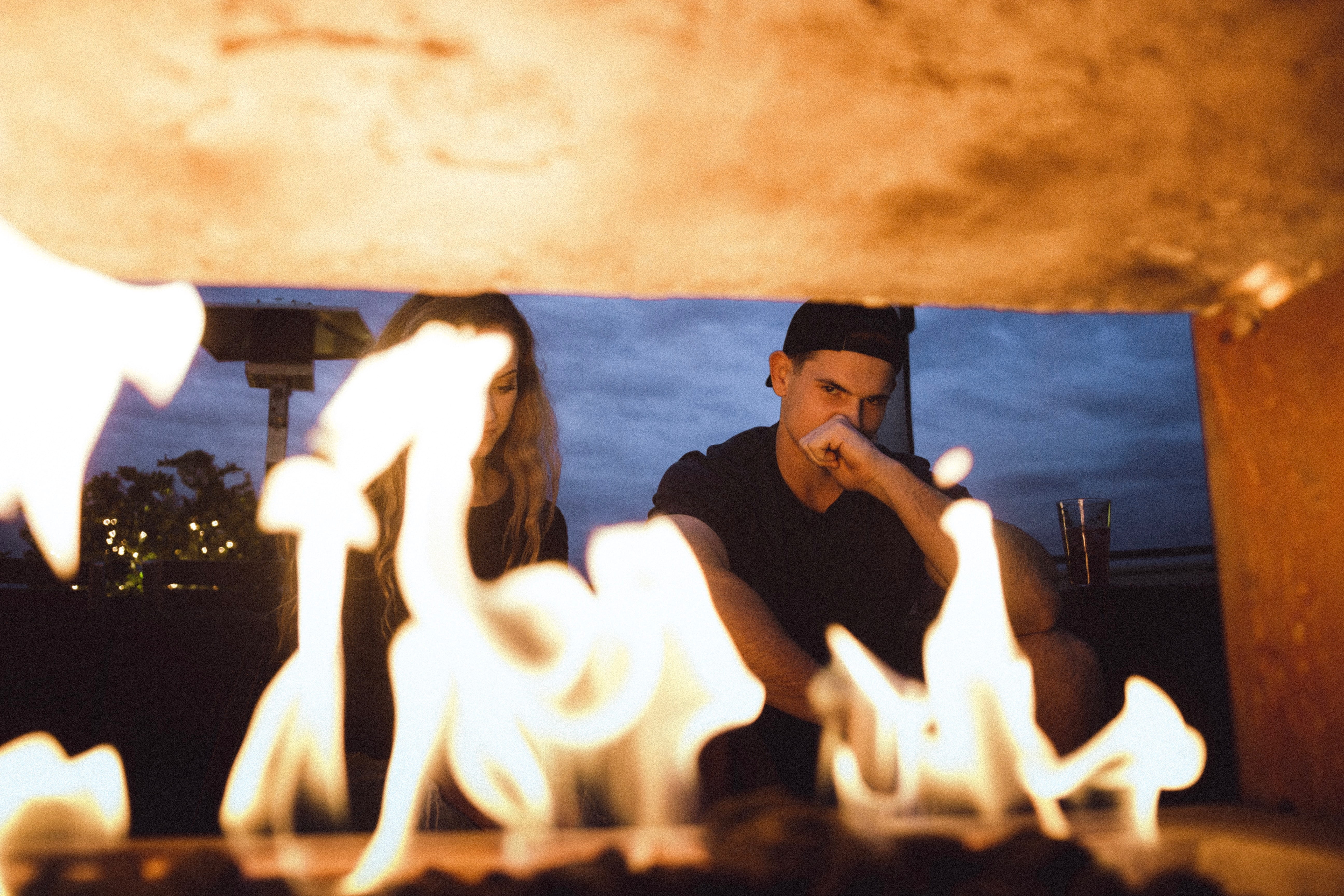 males, heat - temperature, sitting, water, fire - natural phenomenon, firepit, man, holiday, couple, furnace, emotion, trip, vacations, fire, people, 5K, HD Wallpaper