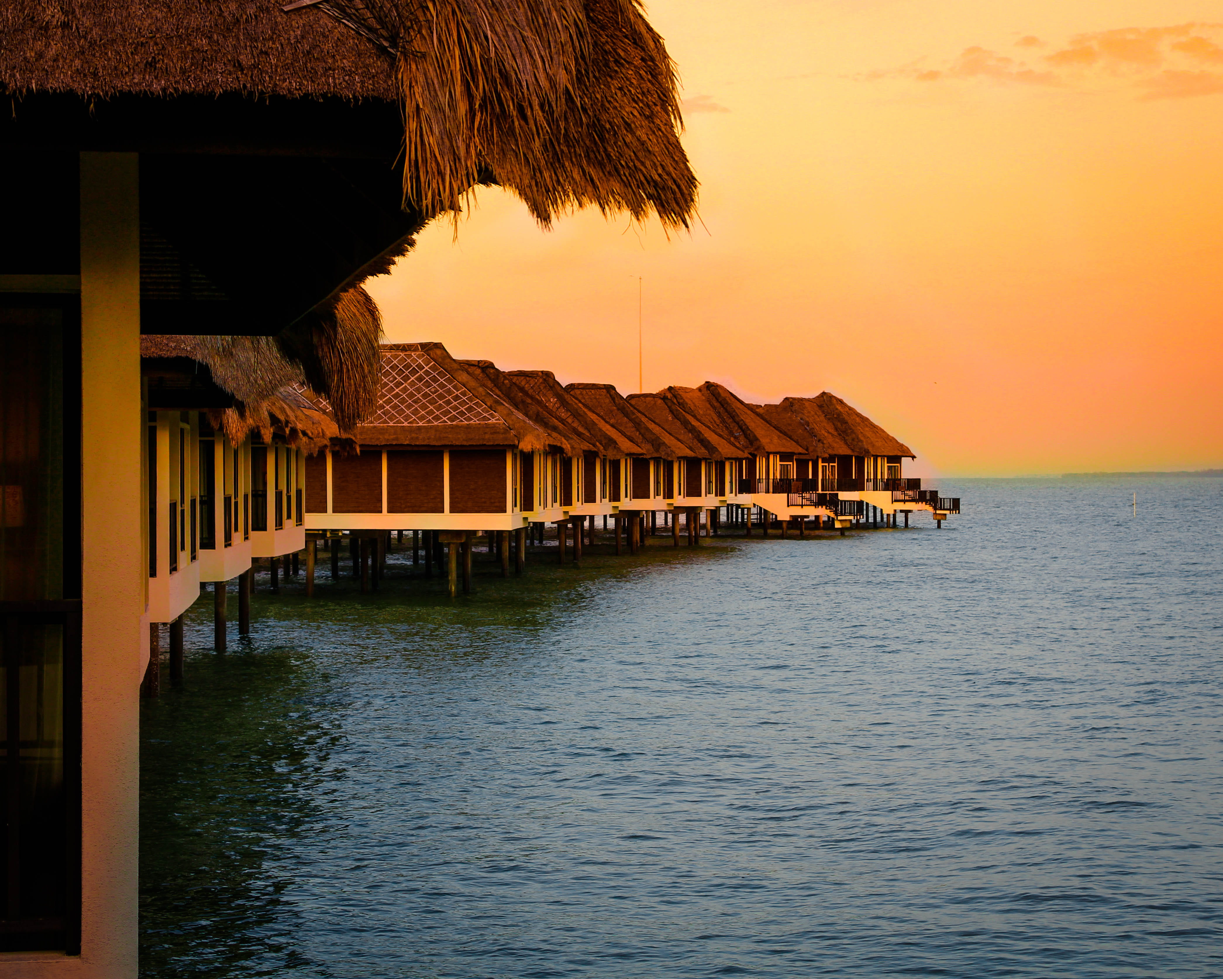 ocean, thatched roof, tranquil scene, tranquility, building, seashore, seascape, water, nature, hut, houses, built structure, stilt, dawn, brown, architecture, HD Wallpaper