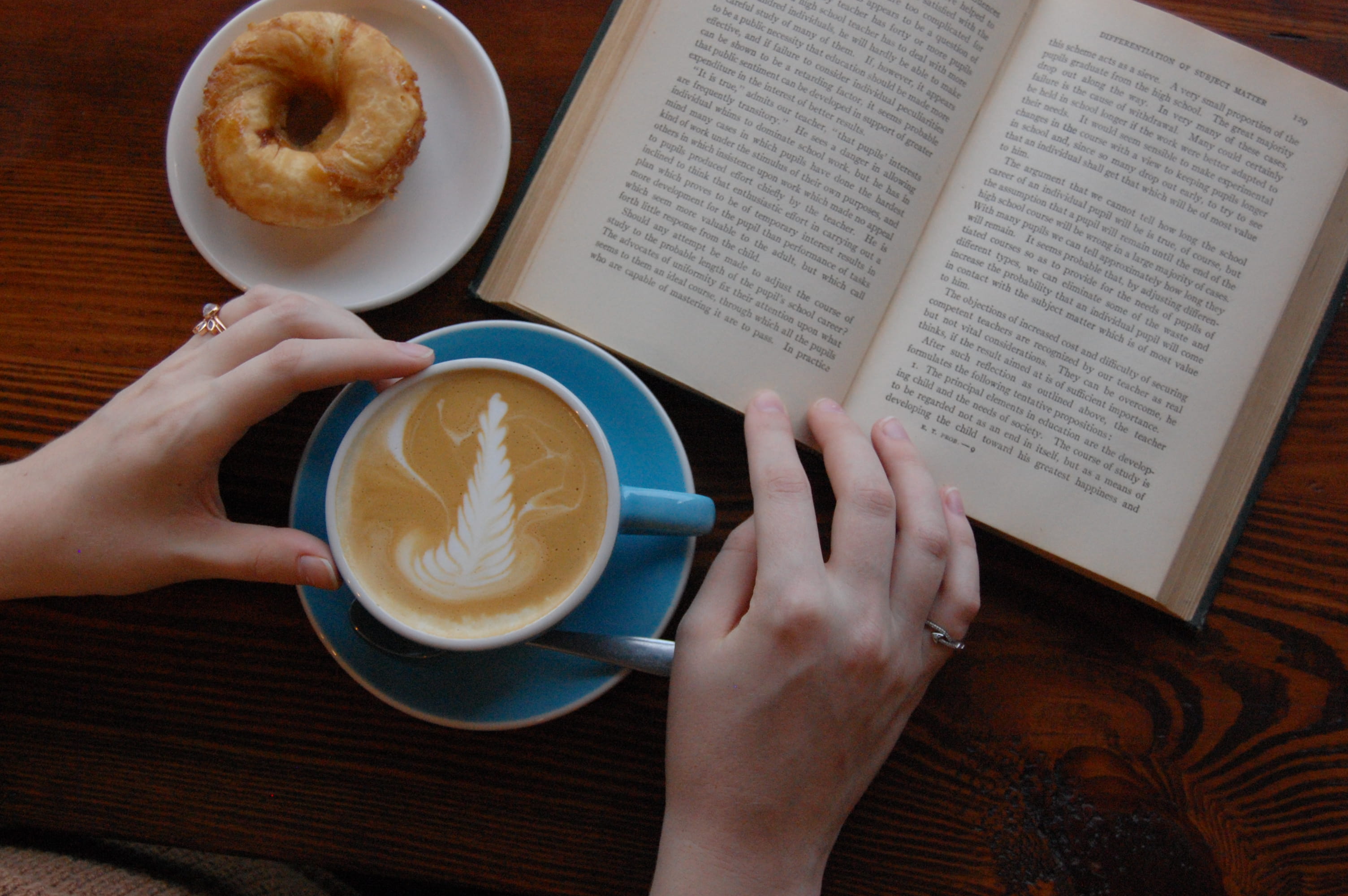 hardwood, finger, ceramic, teacup, book, women, coffee - drink, human hand, coffee cup, holding, beverage, saucer, bagel, latte, drink, one person, table, HD Wallpaper
