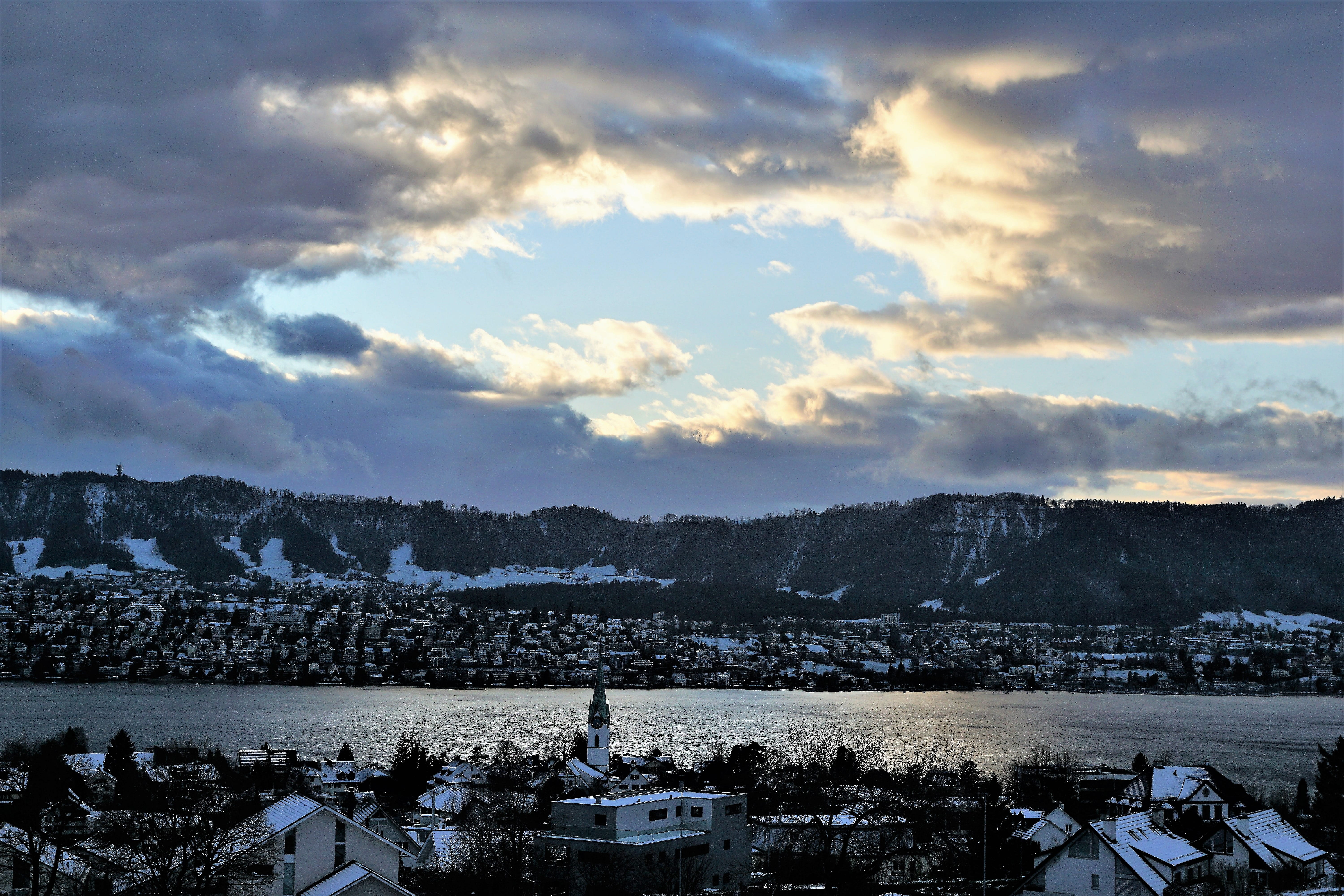 city, 5K, river, winter, architecture, depression, hill, building, built structure, waters, storm, sky, landscape, cold temperature, panoramic image, ray of hope, HD Wallpaper