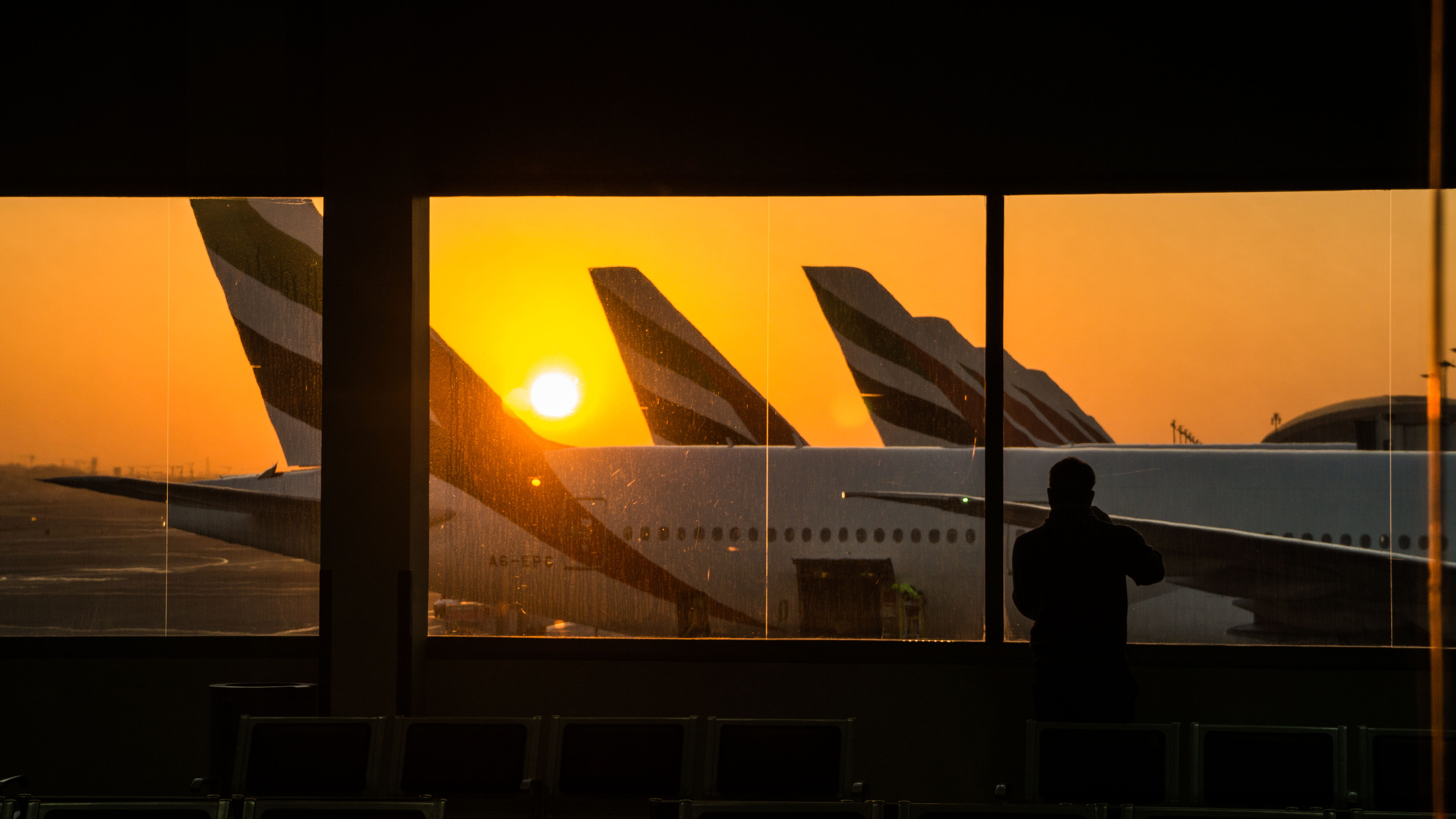 airplane, 5K, men, silhouette, unrecognizable person, transit, one person, dxb, real people, night, leisure activity, architecture, dubai, dubai international airport, HD Wallpaper