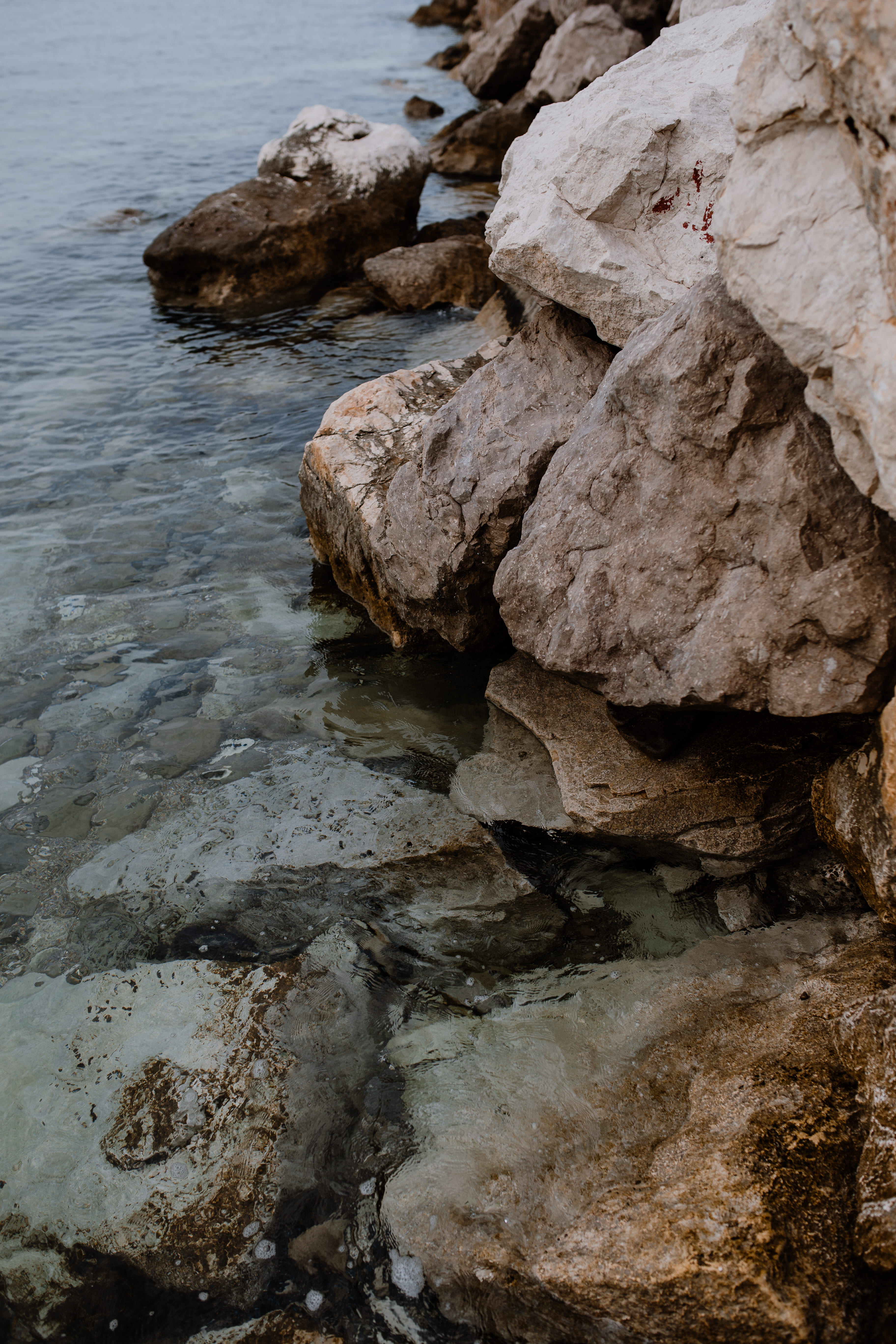motion, blue water, land, nature, no people, tranquility, rock, eroded, beauty in nature, solid, day, sea, textured, rocks, 5K, shallow, outdoors, blue, Phone HD Wallpaper