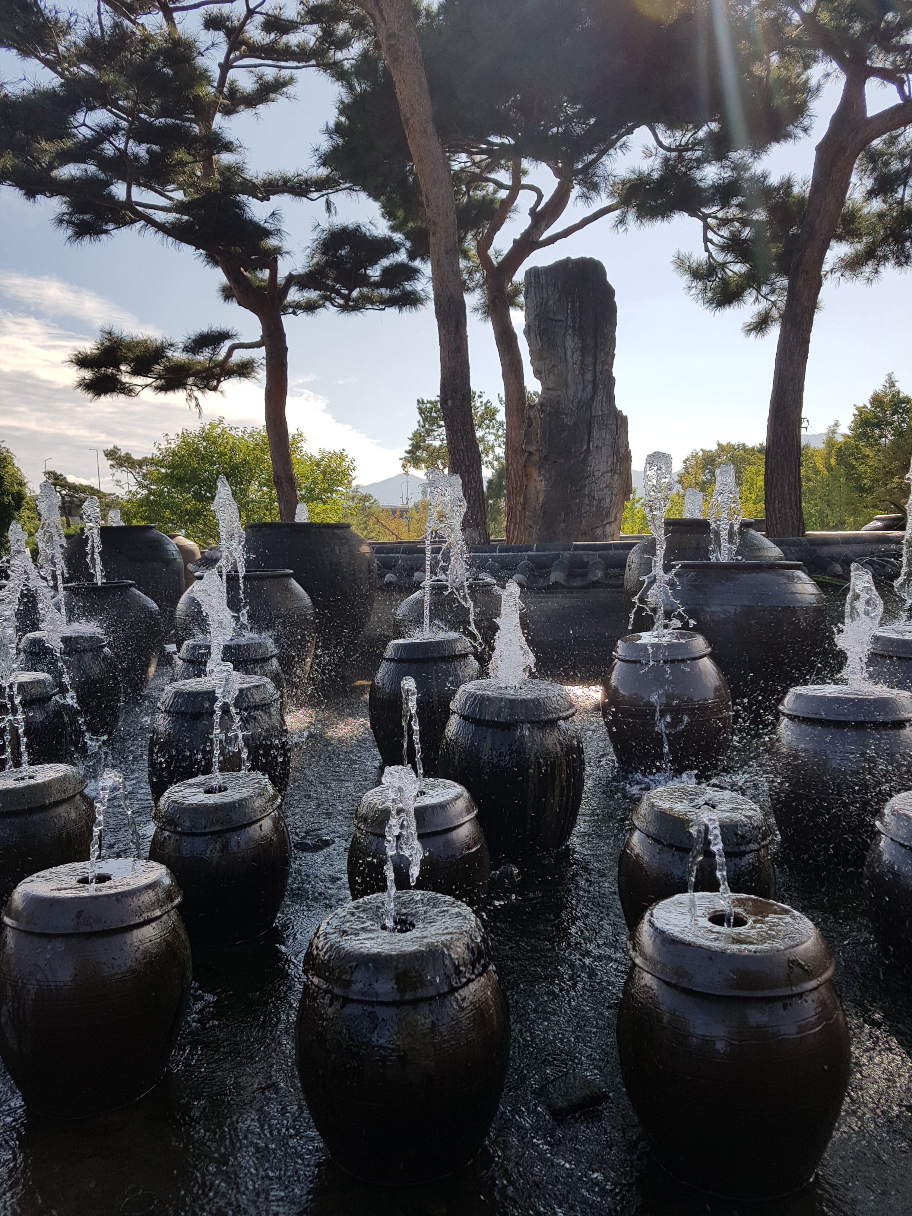 craft, solid, 4K, jar fountain, nature, park, day, fountain, in a row, creativity, two water head, sky, plant, outdoors, art and craft, tree, two jar water fountain, Phone HD Wallpaper