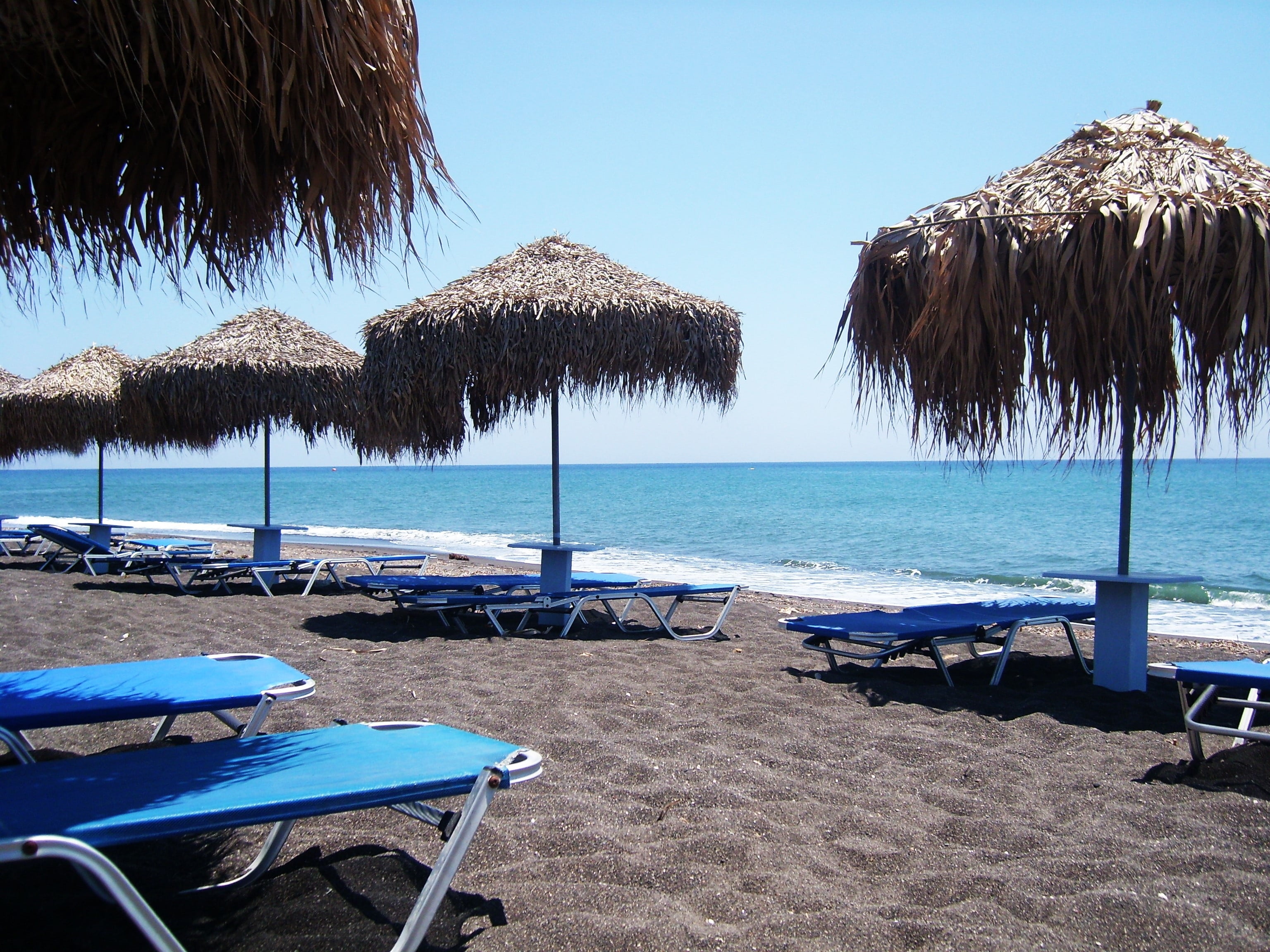 outdoors, seat, absence, land, nature, sea, beach, tranquil scene, santorini, beauty in nature, rest, horizon over water, holiday, black sand, lounge chair, HD Wallpaper