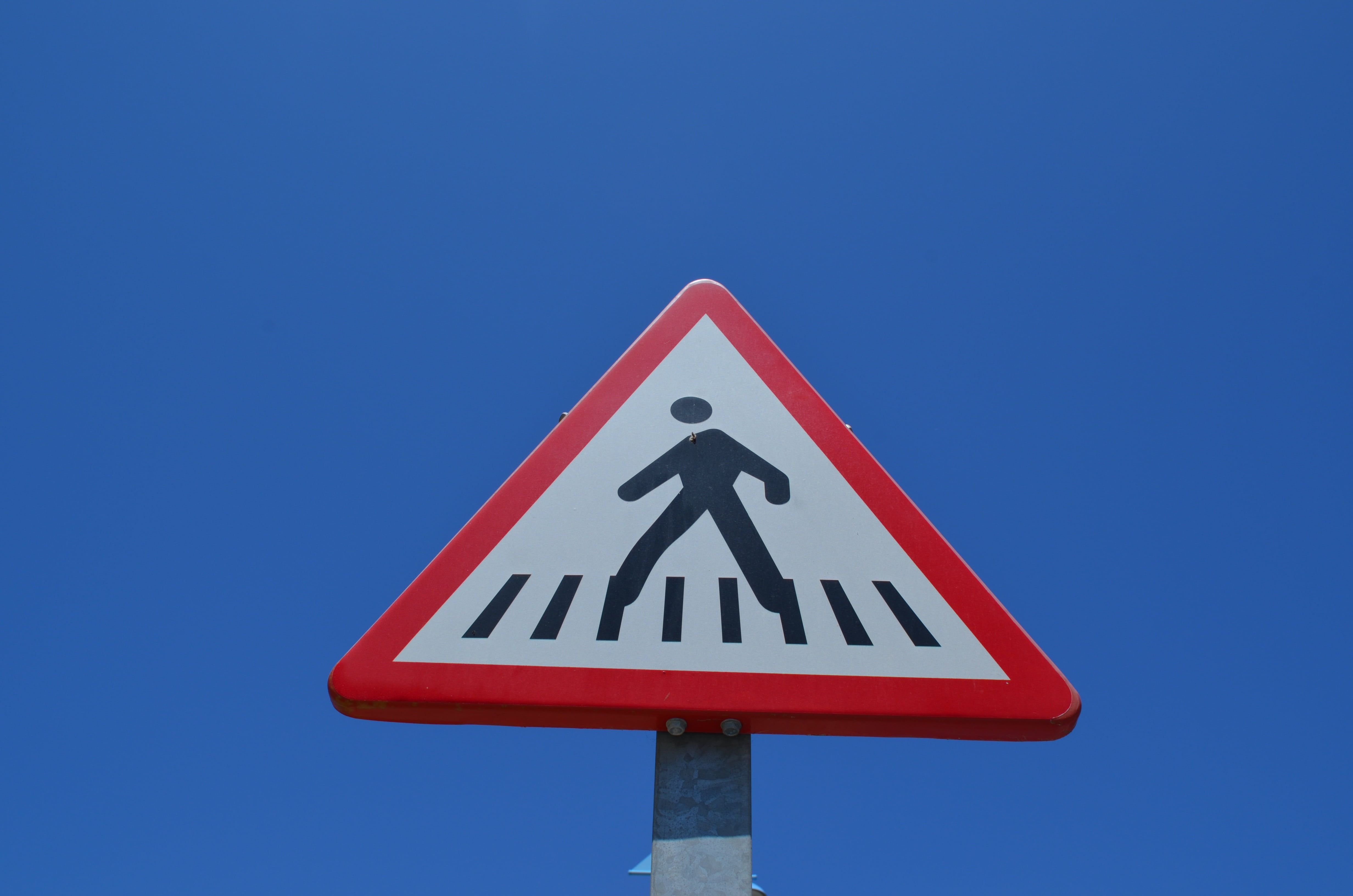 male likeness, road sign, road warning sign, guidance, nature, blue, transportation, road, shield, communication, zebra crossing, shape, traffic sign, human representation, HD Wallpaper
