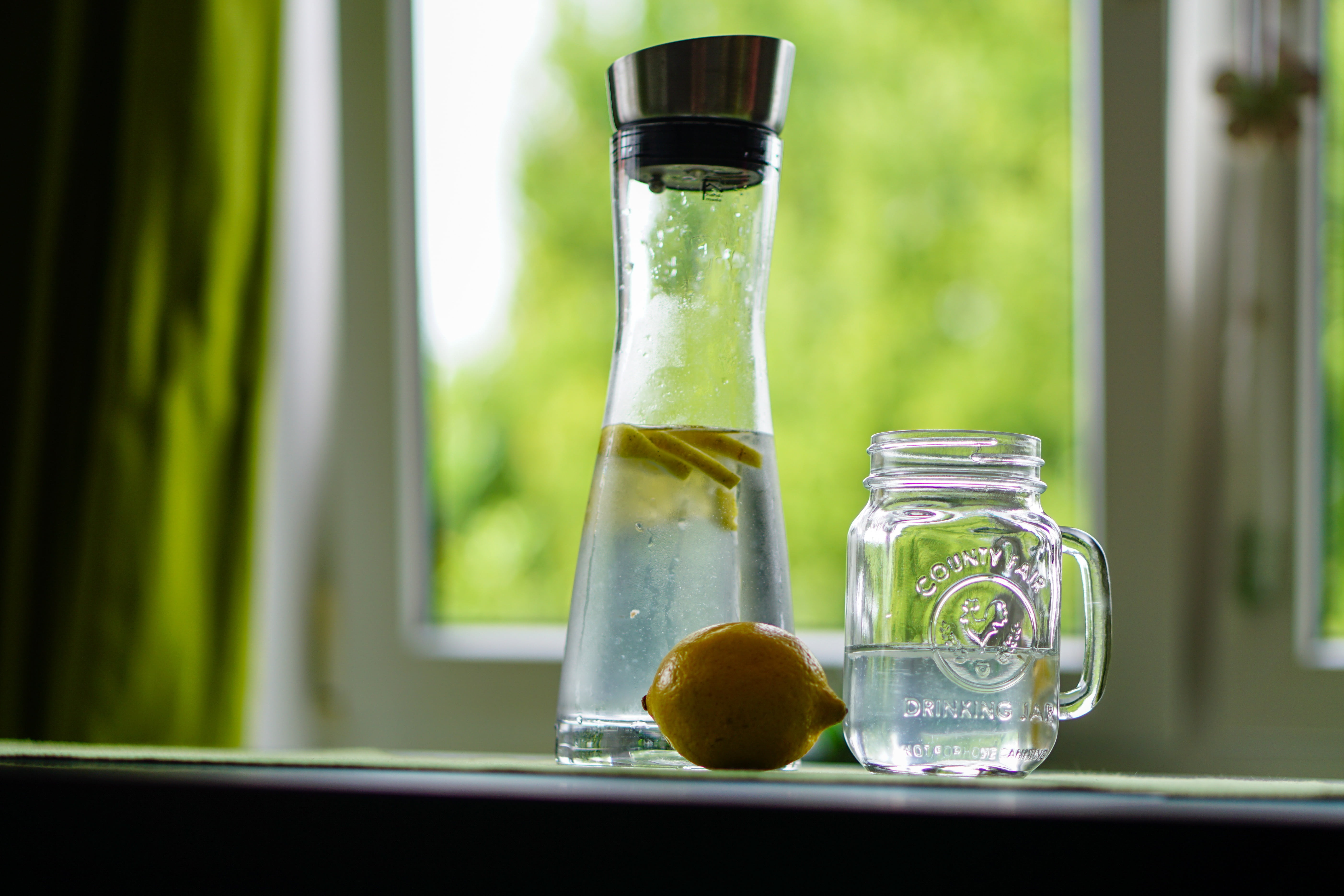 glass carafe, food and drink, refreshment, fruit, spray, focus on foreground, container, carafe, nature, window, fruit juice, science, clear, thirst quencher, HD Wallpaper