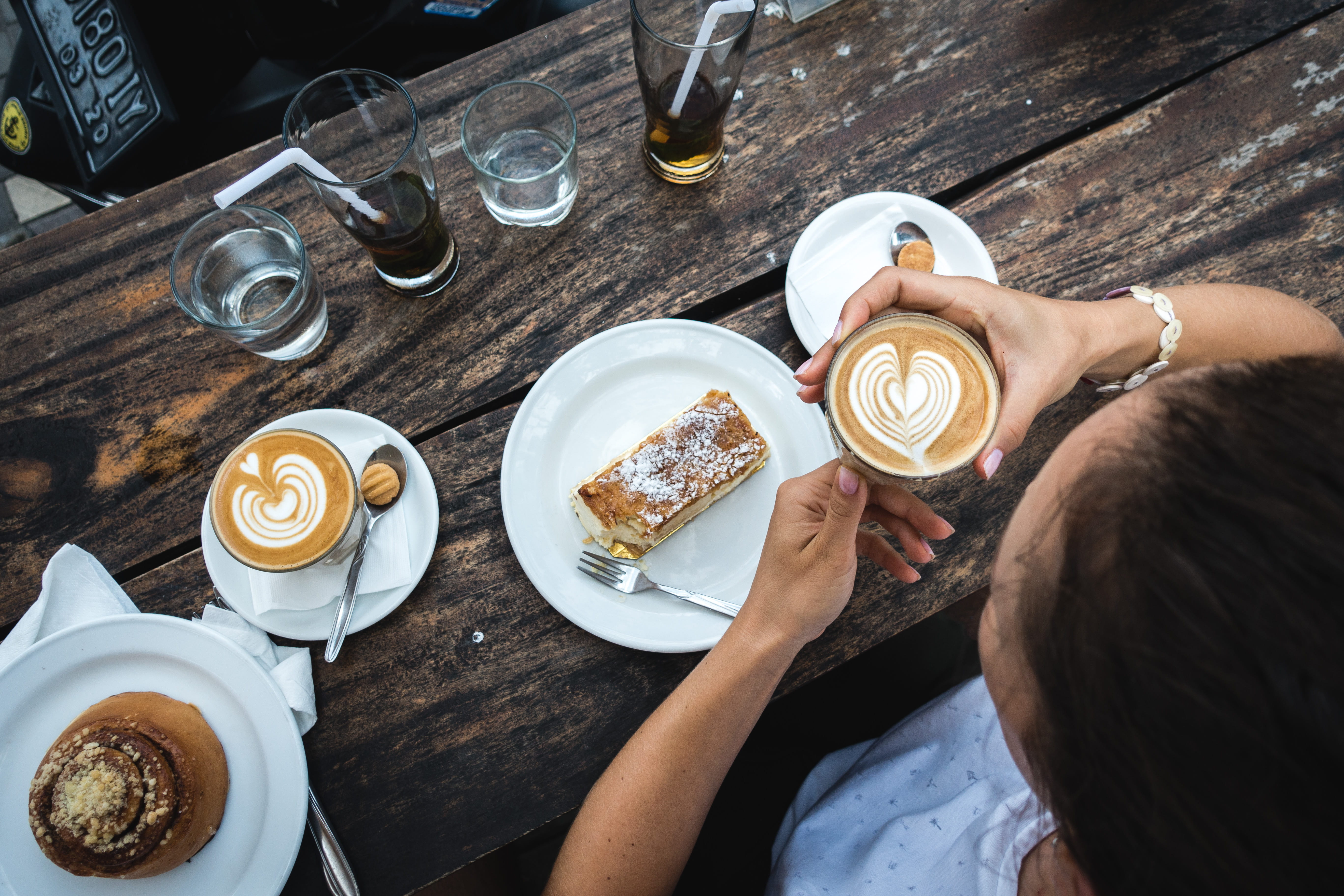 kitchen utensil, frothy drink, relax, high angle view, drink, glass, cafe, saucer, coffee cup, cappuccino, wood, plate, food, sweet, mug, human hand, food and drink, HD Wallpaper