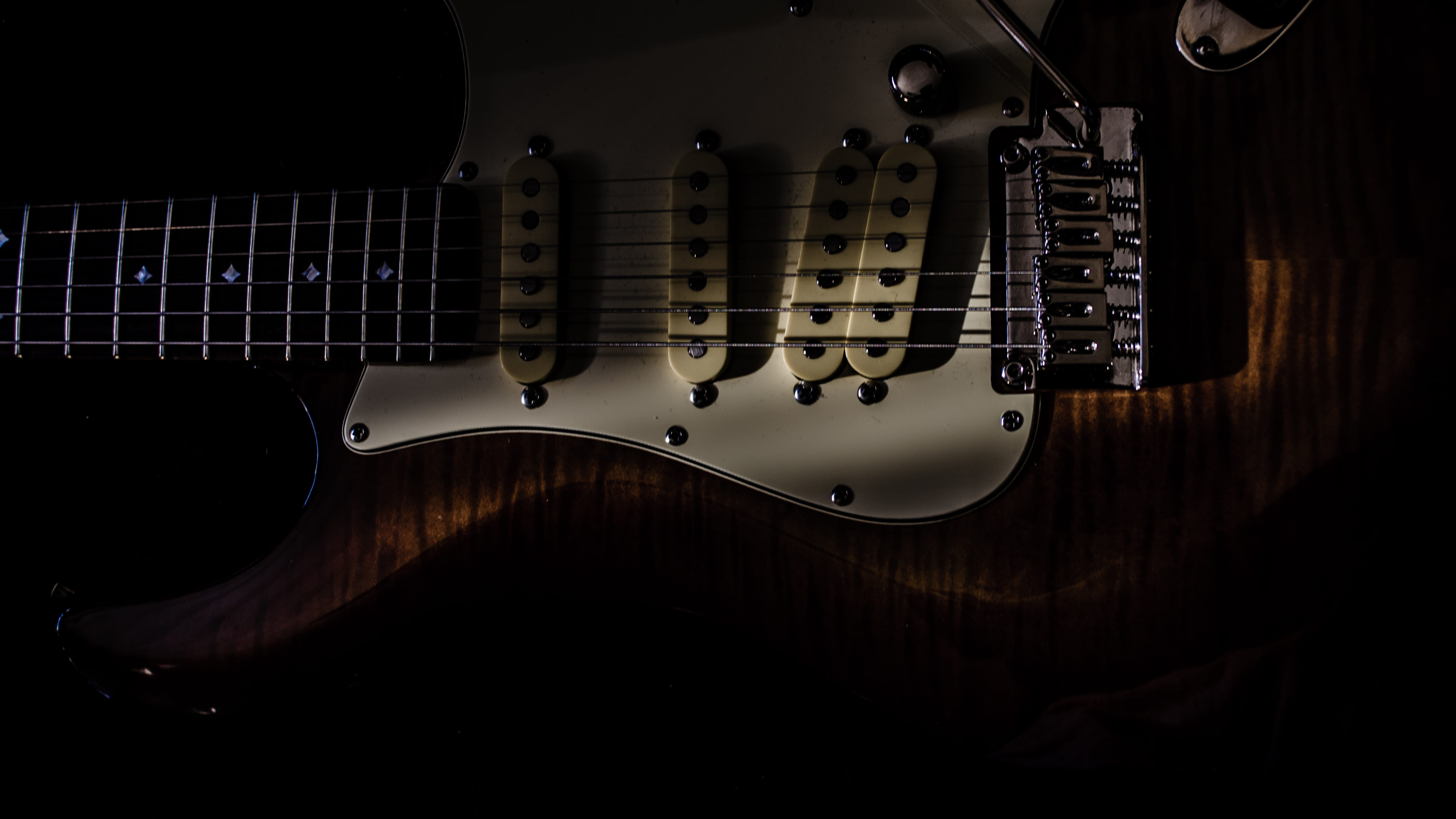  no people, musical equipment, guitar, string, electrical equipment, close-up, sunlight, studio shot, music, string instrument, dark, spotlight, HD Wallpaper