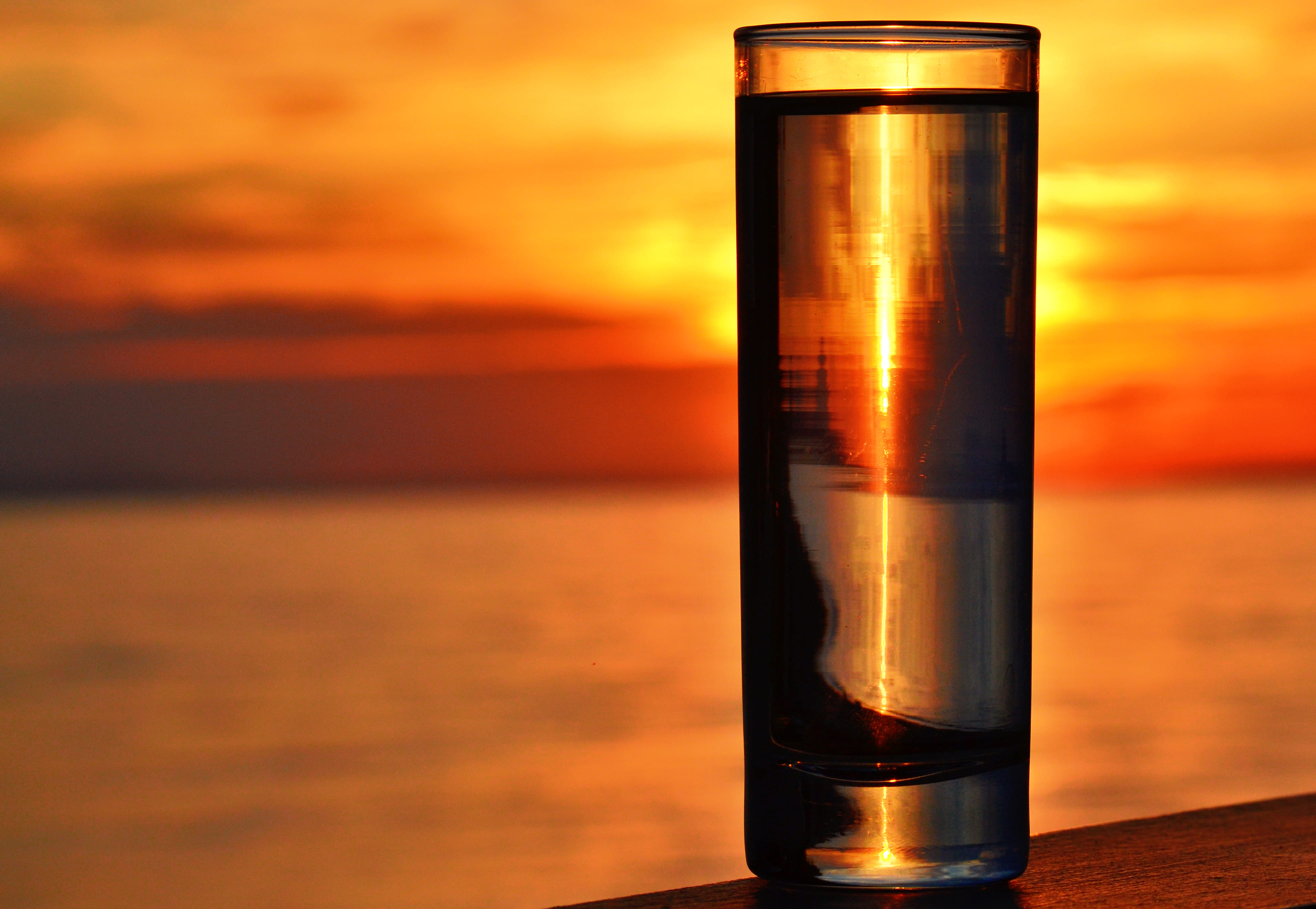 evening, dusk, orange color, no people, sunlight, sea, food and drink, hour, single object, clear, clouds, ocean, outdoors, sunset, glass, seascape, table, HD Wallpaper