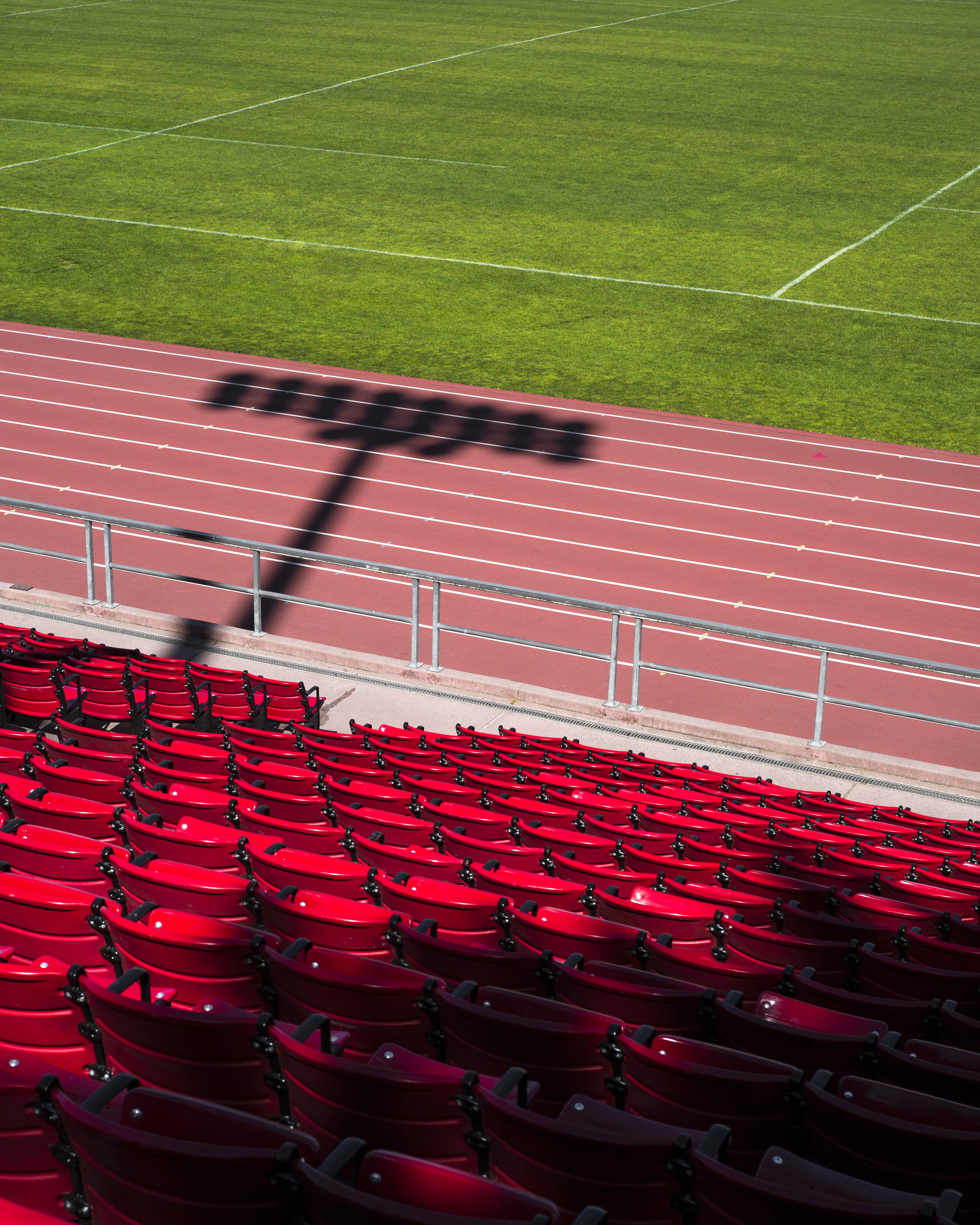 track and field, soccer, absence, outdoors, silhouette, competition, sport, 4K, high angle view, sunlight, grass, bleachers, track, green color, empty, Phone HD Wallpaper