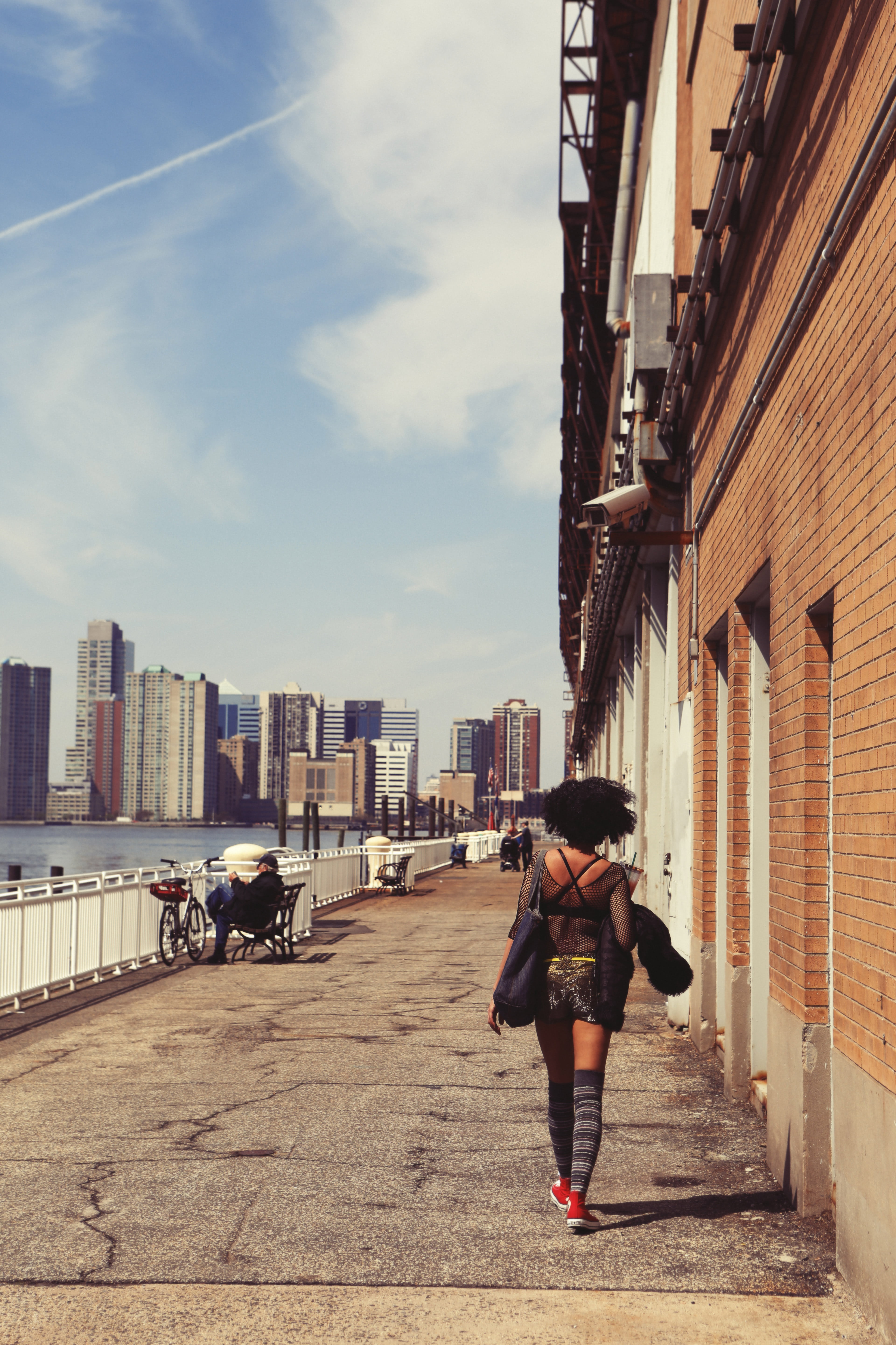 building exterior, beside, sidewalk, walking, built structure, lifestyles, river, buildings, sky, african american, outdoors, architecture, wall, full length, Phone HD Wallpaper