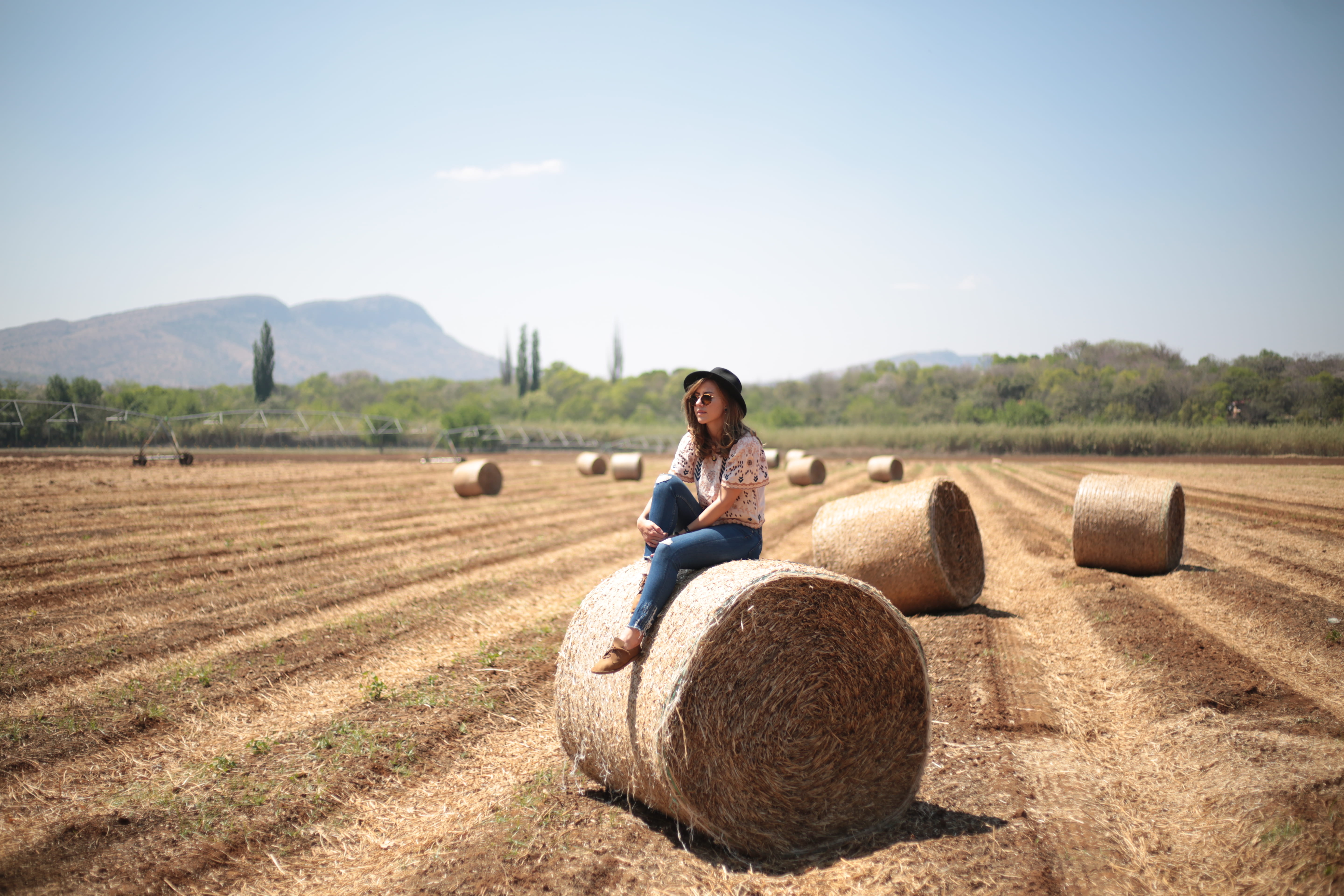 sunlight, 5K, explore, day, round, haystack, woman, landscape, plant, agriculture, style, girl, hale, nature, adult, farm, land, adventure, tree, sky, HD Wallpaper