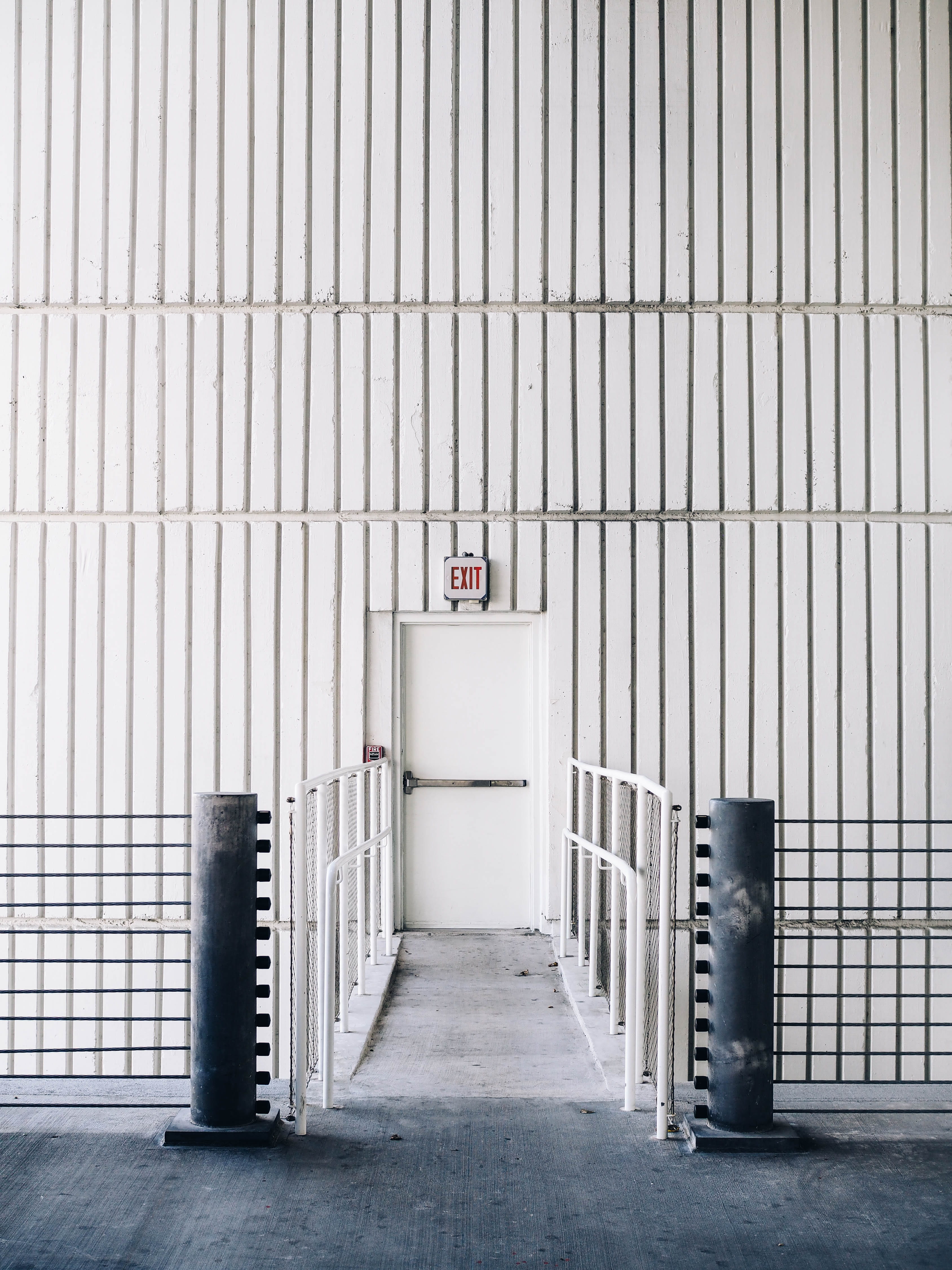 barrier, garbage bin, wall, inside, parking garage, fire escape, exit, location, symmetry, door, architectural, garage, indoors, metal, absence, flooring, Phone HD Wallpaper