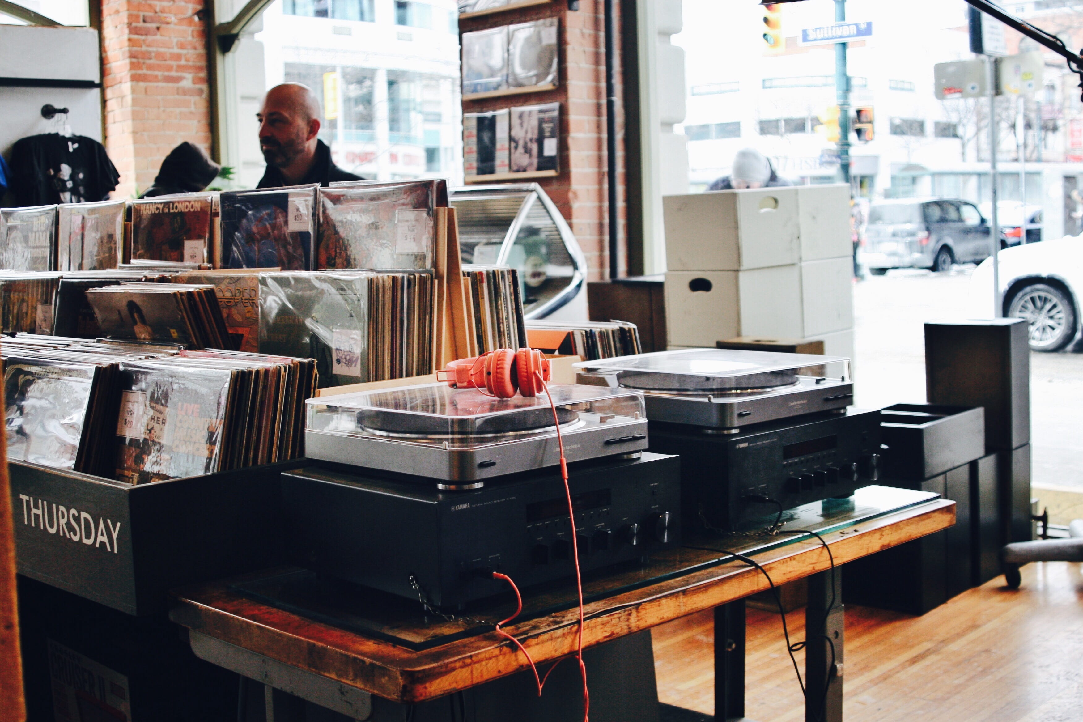receivers, occupation, window, real people, music, glass - material, gray, focus on foreground, technology, table, turntables, headphones, 2K, records, HD Wallpaper