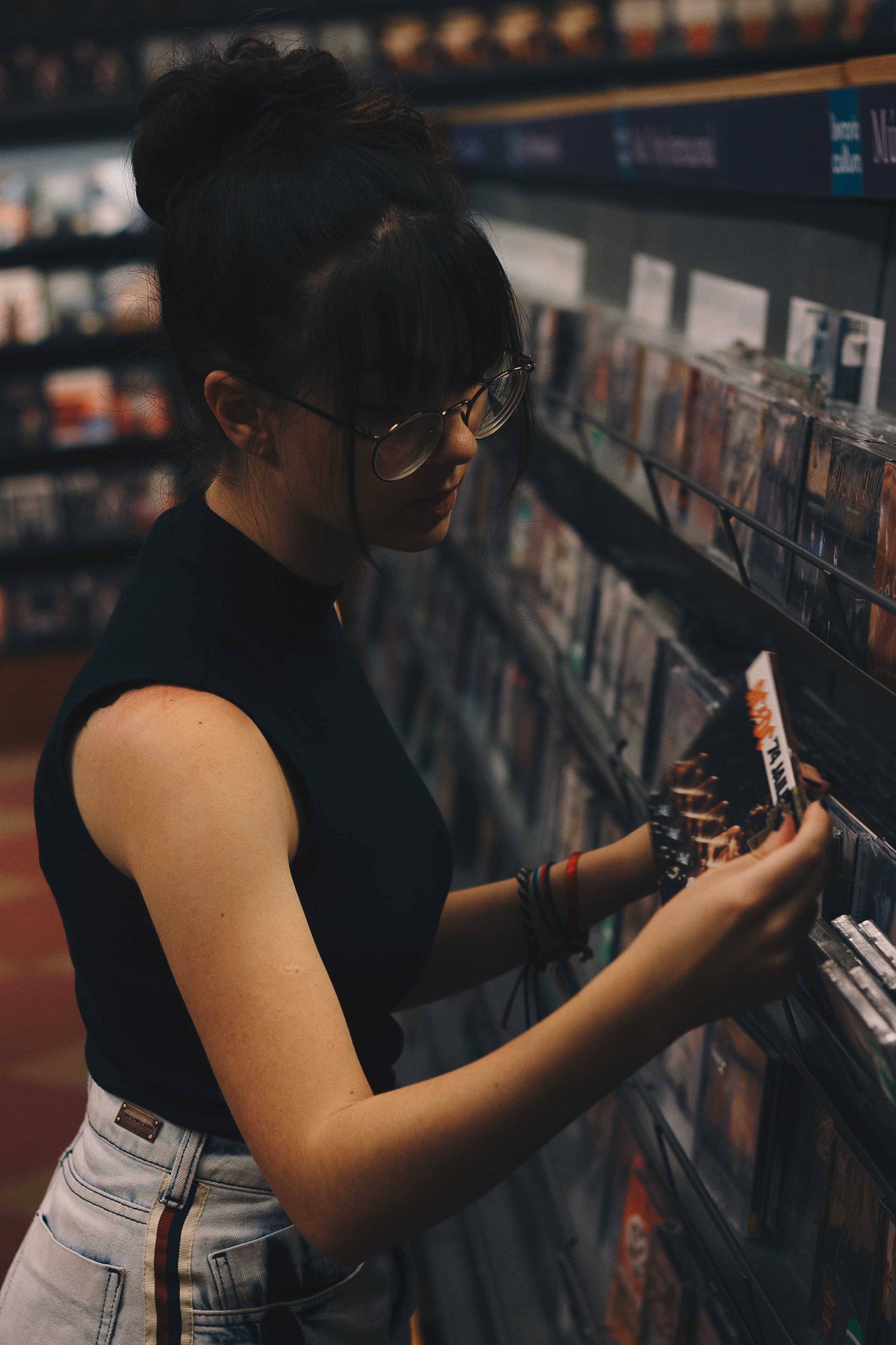 retail, arts culture and entertainment, woman, women, cds, glasses, rack, case, display, lifestyles, black, music, indoors, pose, beauty, holding, cd, adult, Phone HD Wallpaper