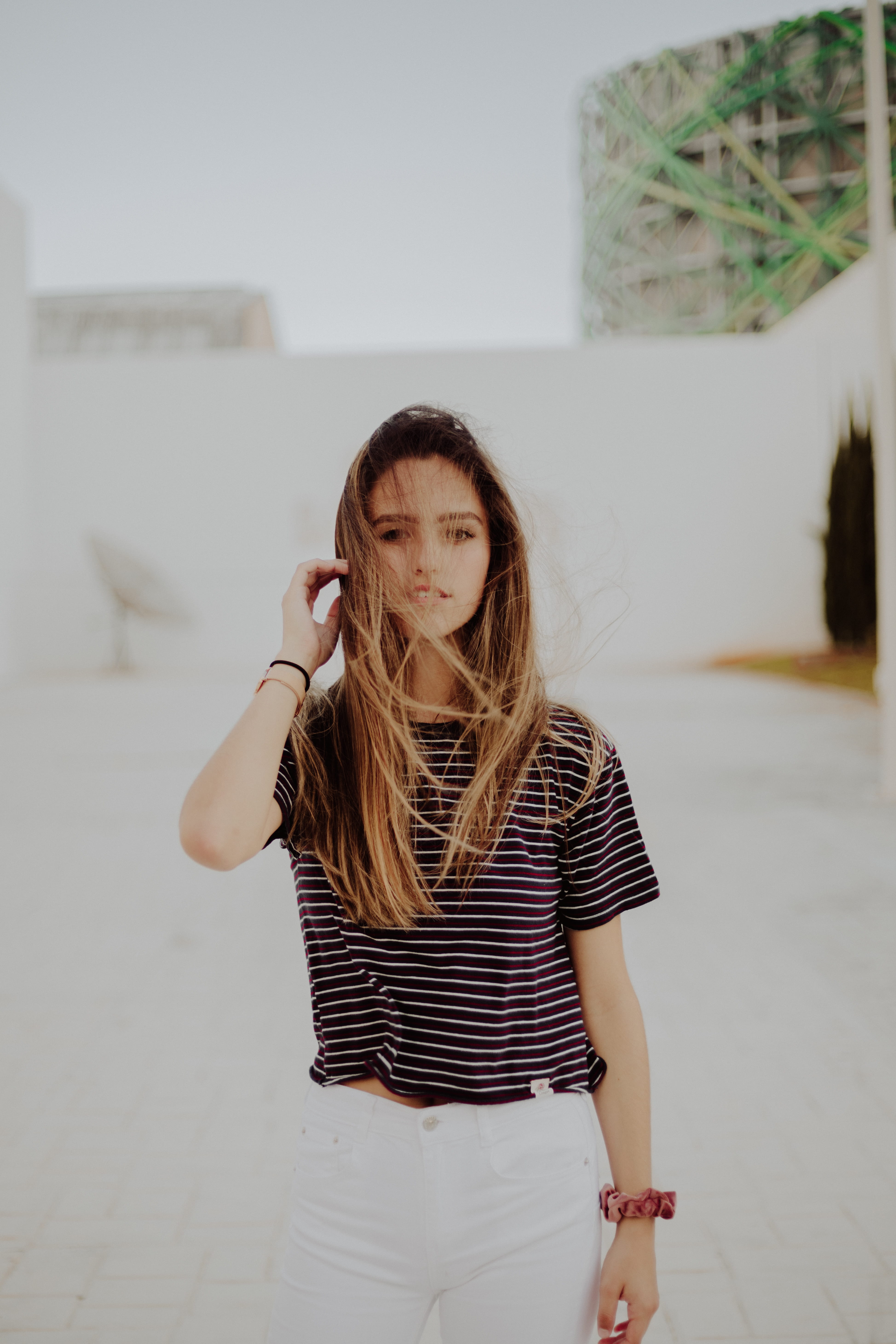 womenswear, 5K, wall, near, striped, faded, long hair, woman, white, hairstyle, outdoors, brunette, hair tie, one person, front view, girl, building, person, Phone HD Wallpaper
