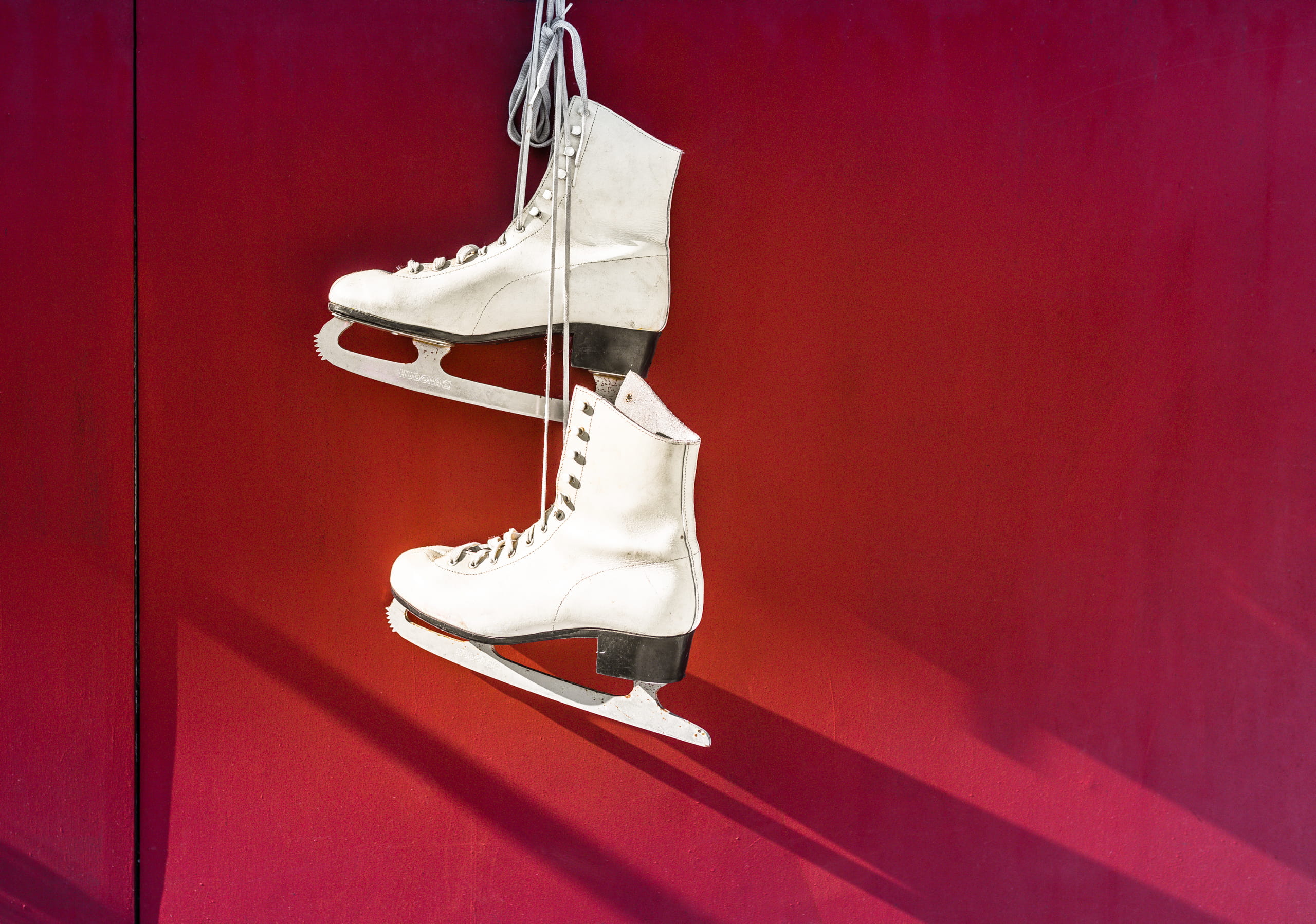 ice skates, ice-skating, colored background, indoors, pair, lifestyles, white, blades, white color, womenswear, hanging, hanged, wall - building feature, HD Wallpaper