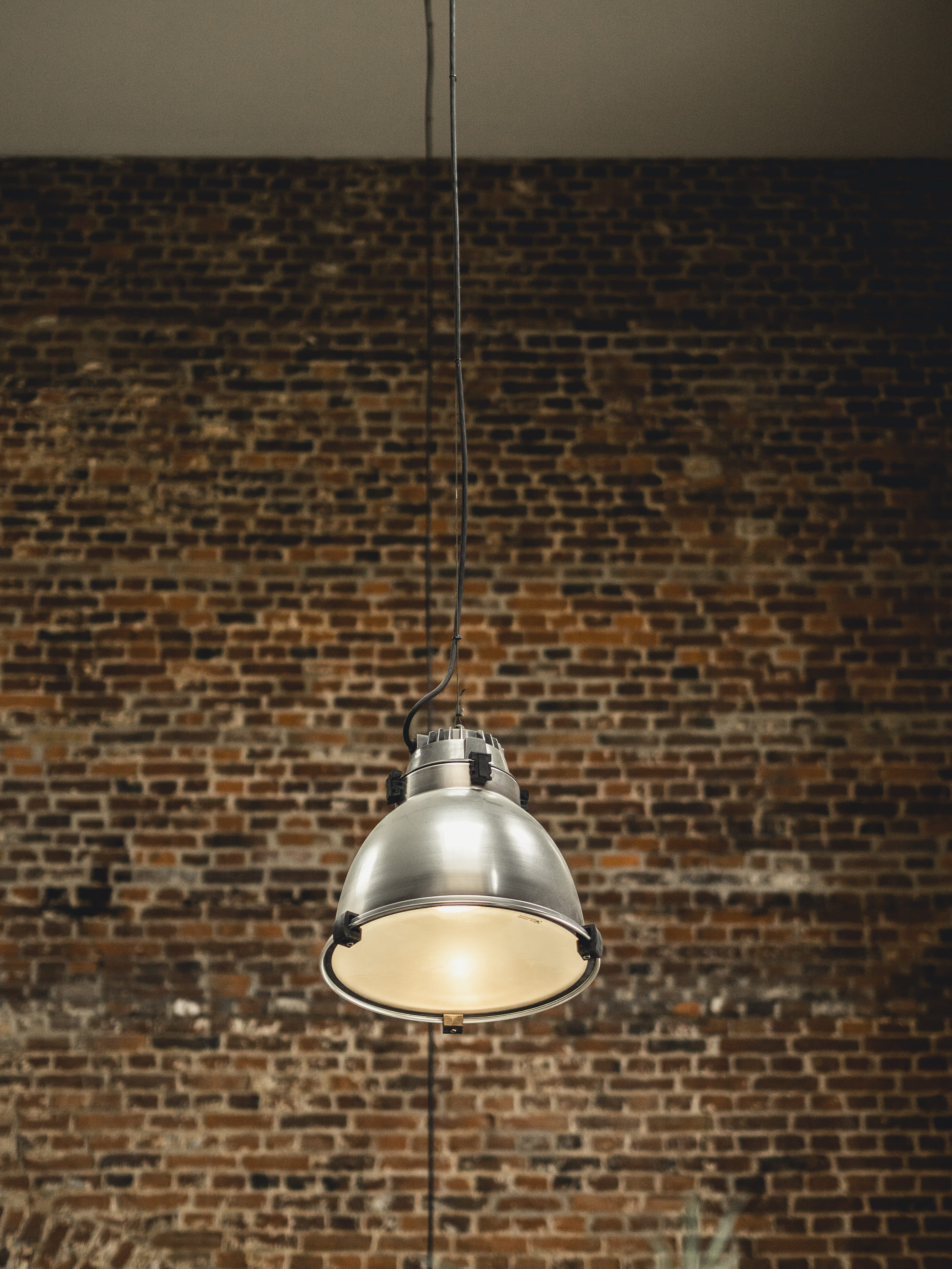 steel, plaque, sidewalk, pavement, planter, hanging, wall - building feature, pendant light, strap, lighting, brick wall, potted plant, lighting equipment, Phone HD Wallpaper