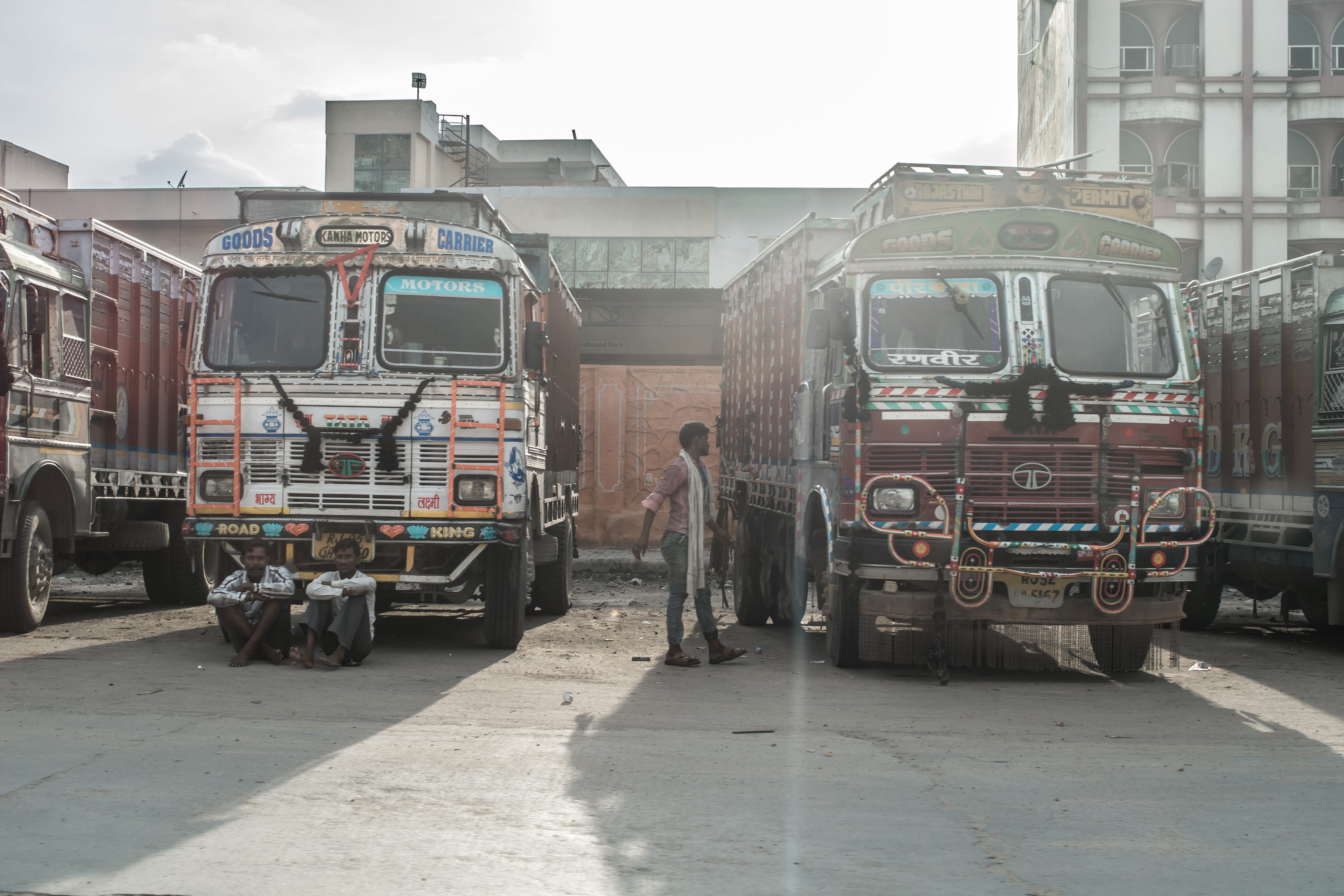 men, working, occupation, one person, travel, rear view, building exterior, built structure, 5K, day, sky, truck, street, carrier, tata, real people, trucks, HD Wallpaper