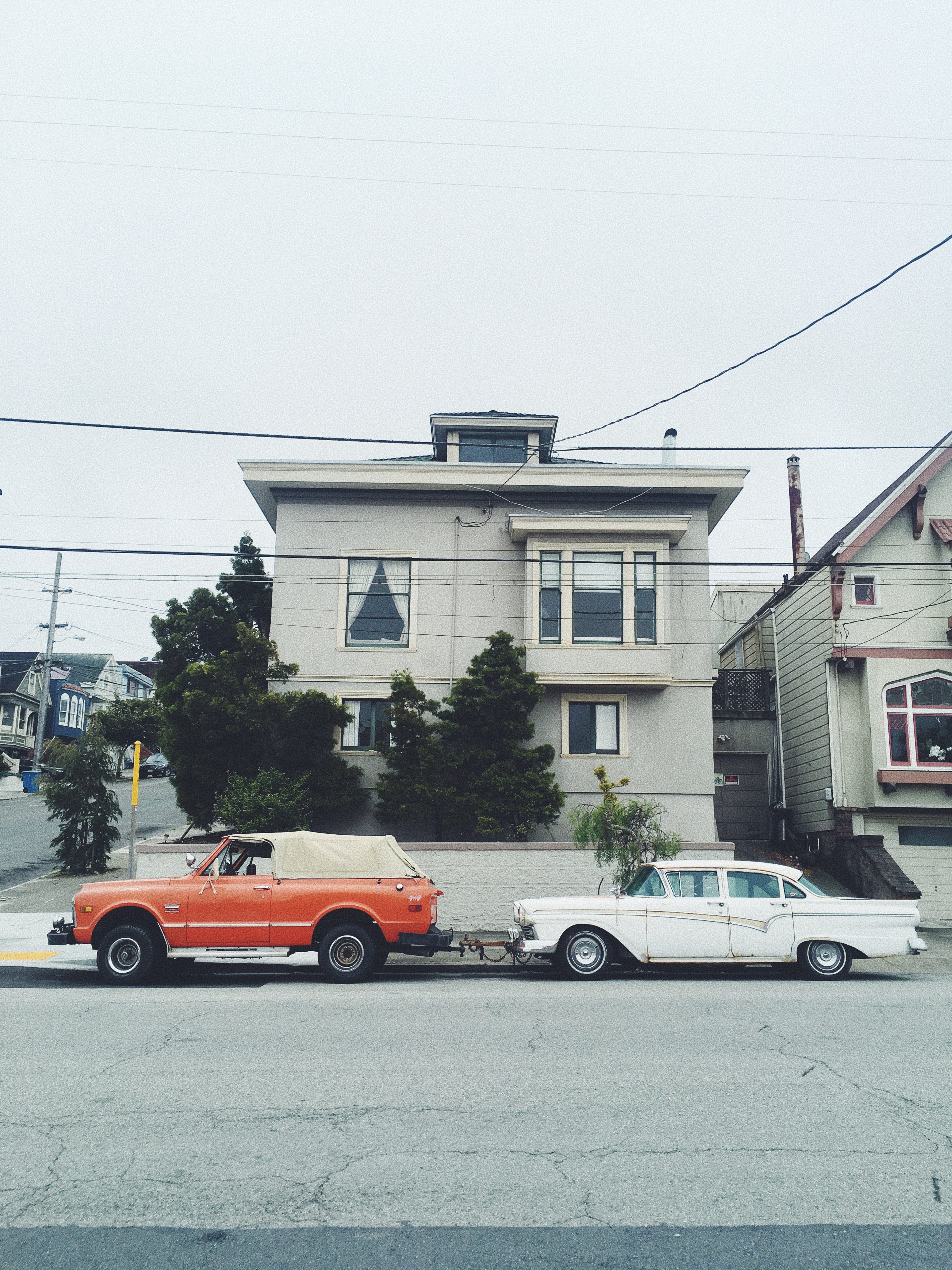 parked, car, street, white, house, urban Scene, near, truck, 4K, road, city, pickup, retro, tow, building Exterior, classic car, transportation, daytime, Phone HD Wallpaper