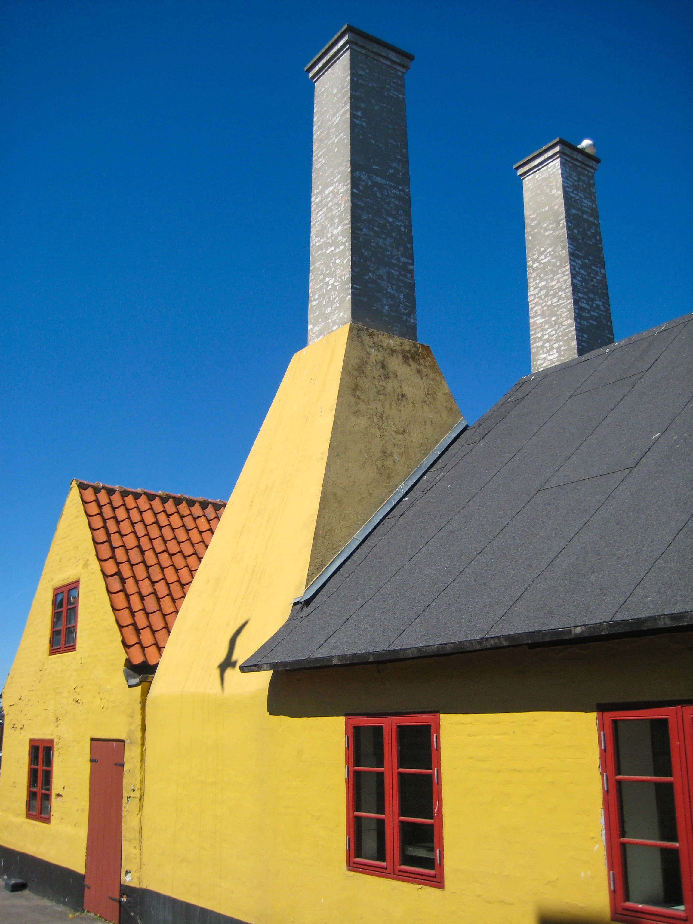 outdoors, low angle view, tower, blue, no people, building, tall - high, chimneys, spire, 2K, city, travel destinations, nature, travel, yellow, sky, clear sky, Phone HD Wallpaper