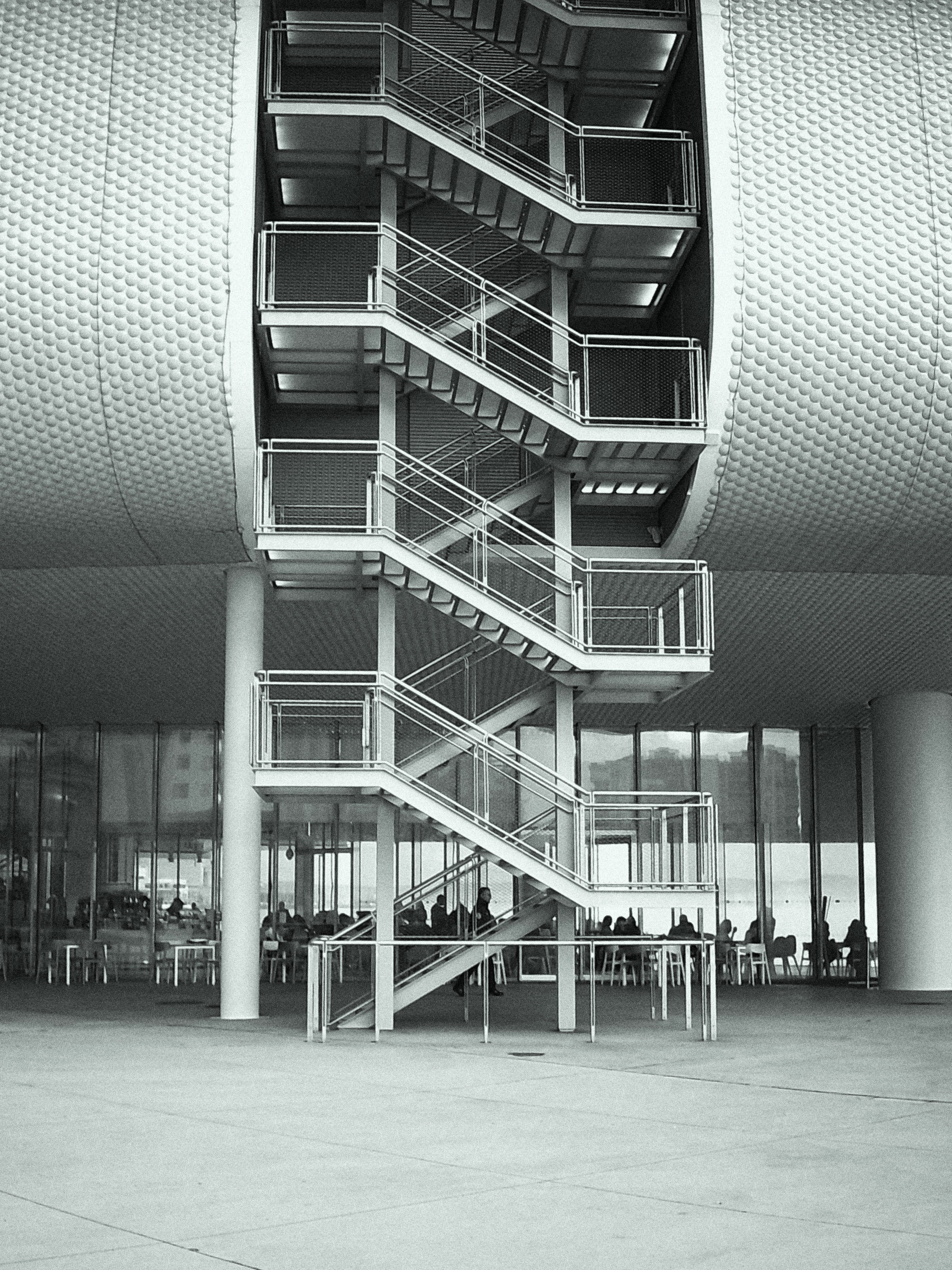 fire escape, renzopiano, building exterior, contemporary architecture, sea, railing, people, art, black and white, modern, ceiling, digifilm, curve, day, Phone HD Wallpaper