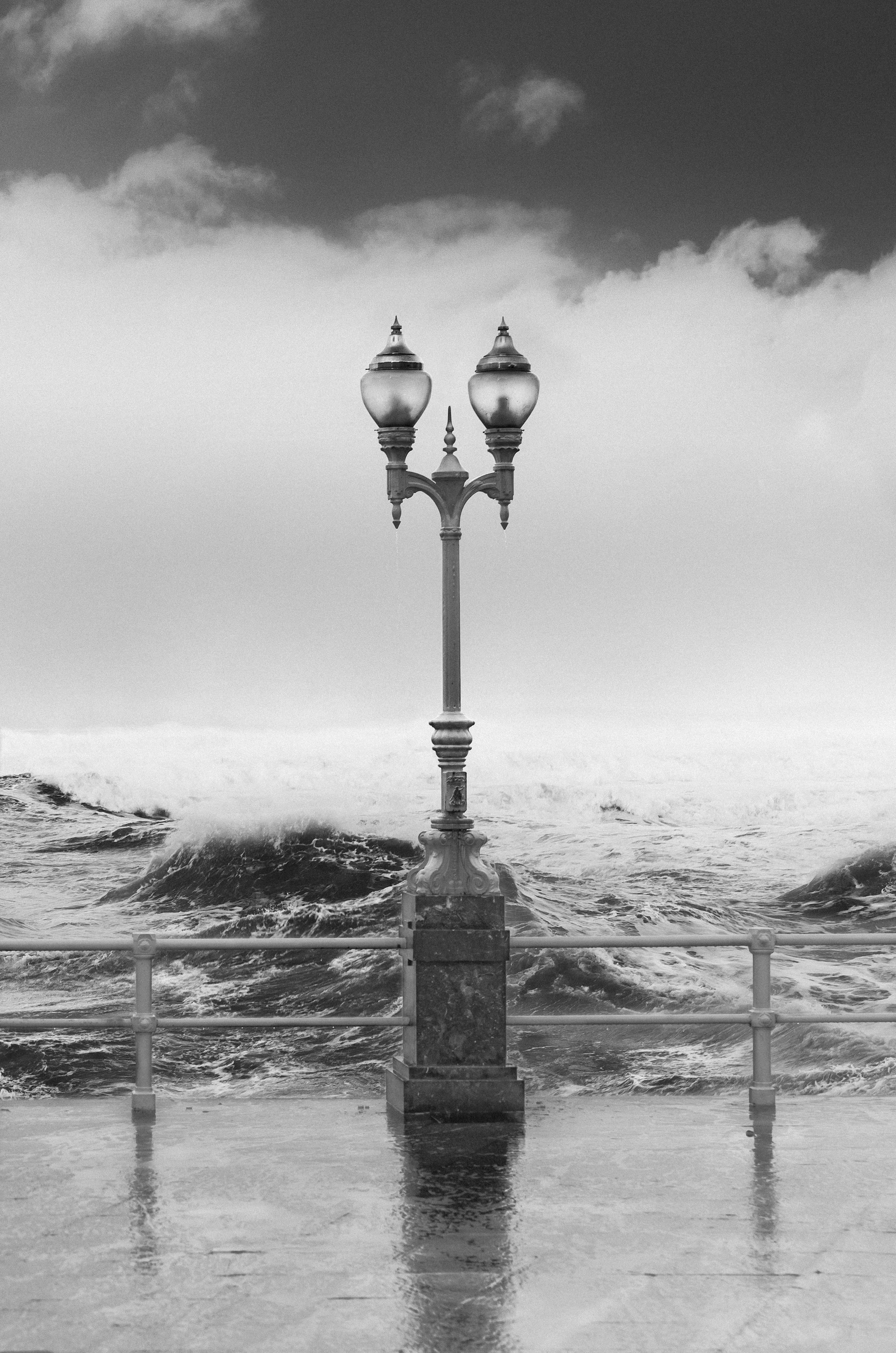 architecture, grayscale, cold temperature, wafe, photo, lantern, storm, seashore, ocean, rain, streetlamp, outdoor, waterfront, black and white, Phone HD Wallpaper