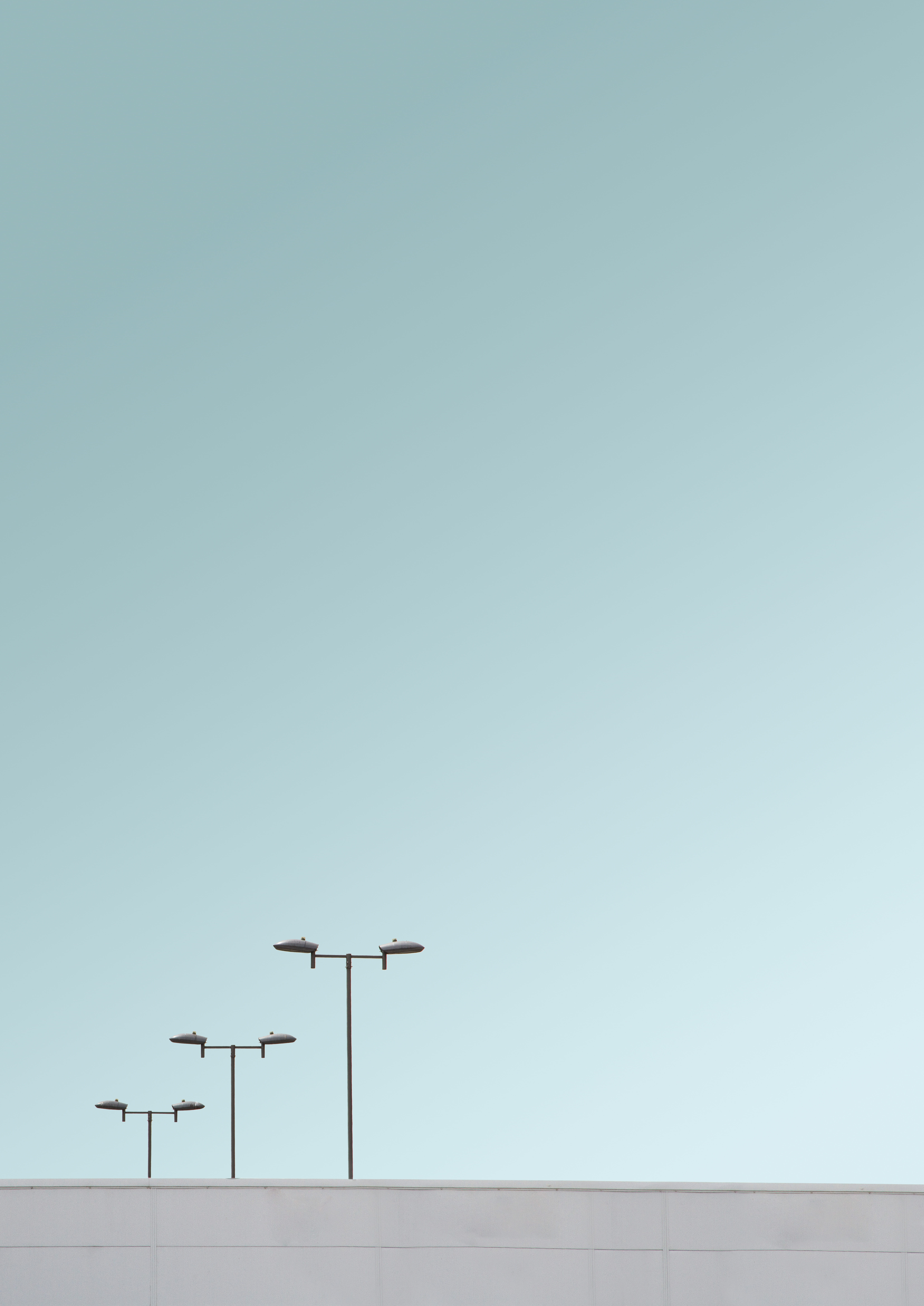 posts, blue, architecture, connection, archiporn, built structure, front, sky, streetlamp, 8K, television aerial, skies, modern, clear, antenna - aerial, Phone HD Wallpaper