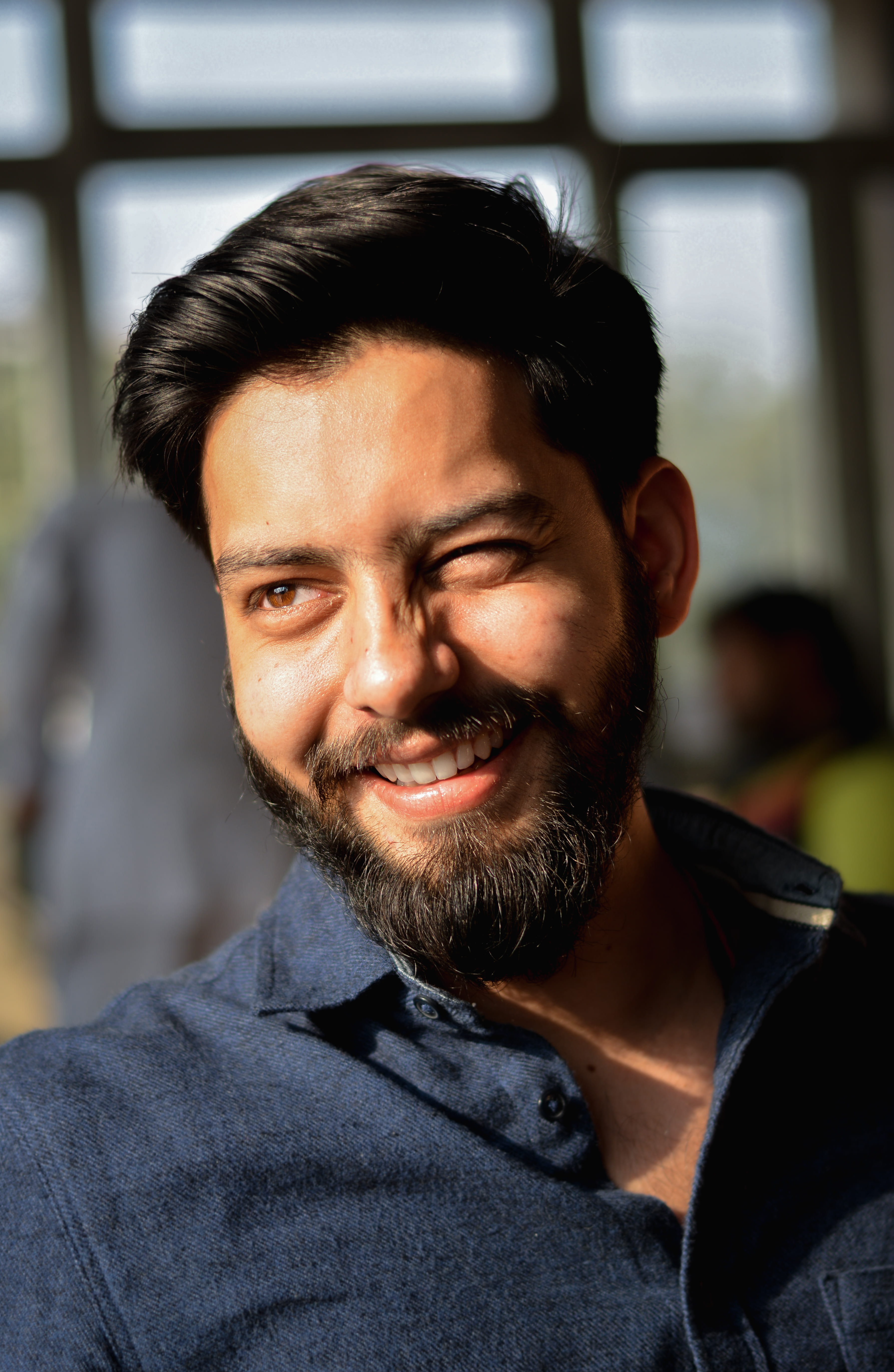 smiles, mid adult men, indoors, masculine, india, hairstyle, wink, headshot, young adult, model, eye, eyes, front view, one person, sunlight, facial hair, Phone HD Wallpaper