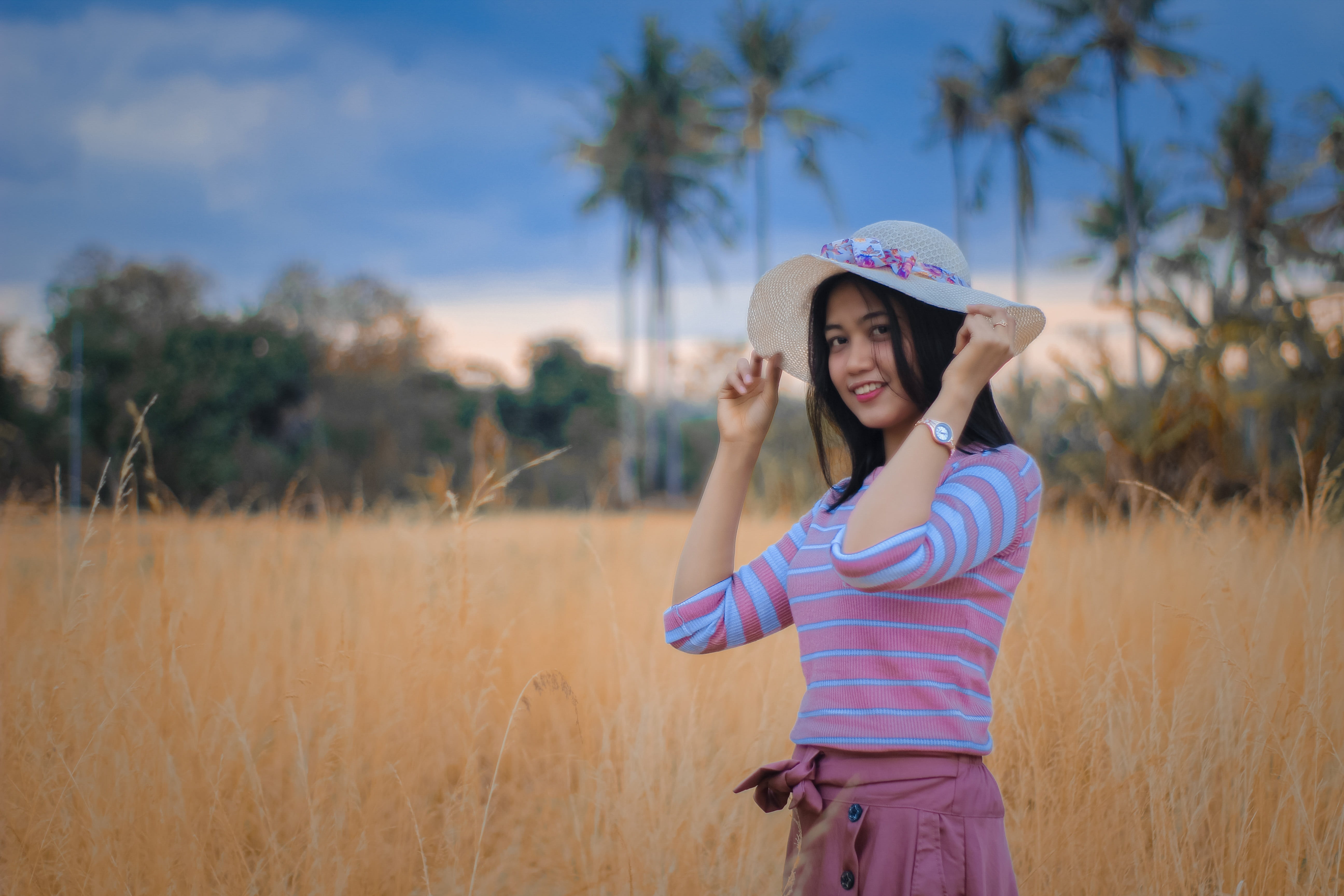 casual clothing, smiling, indonesia, girls, day, one person, clothing, girl, standing, sun hat, front view, three quarter length, focus on foreground, field, HD Wallpaper