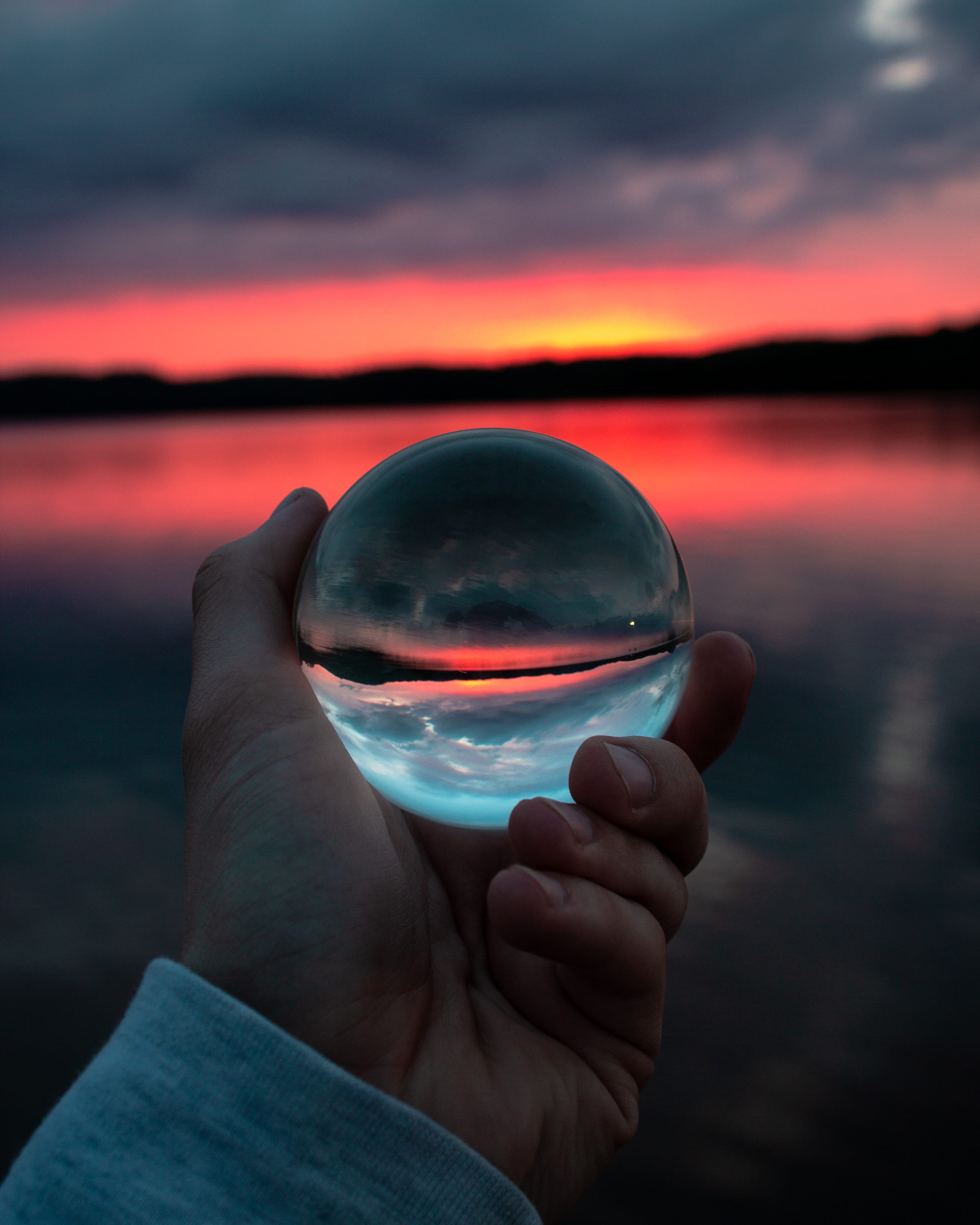 beauty in nature, clouds, sunset, crystal ball, personal perspective, scenic, reflections, human hand, human body part, h2o, clear, sphere, sky, transparent, Phone HD Wallpaper