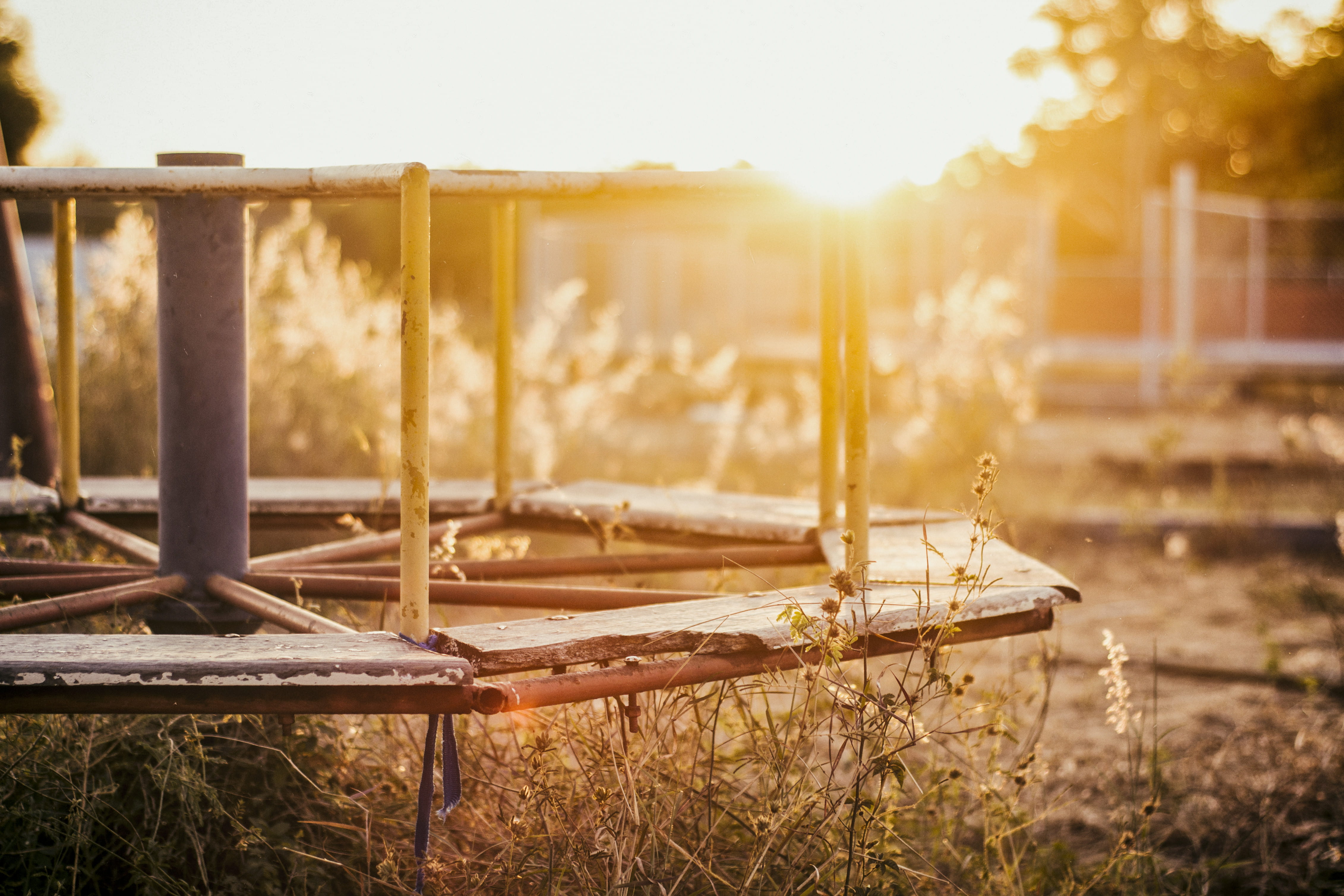 sunset, tranquility, wood - material, nature, merry-go-round, playground, sunlight, day, abandoned, light, focus on foreground, lens flare, land, outdoors, HD Wallpaper
