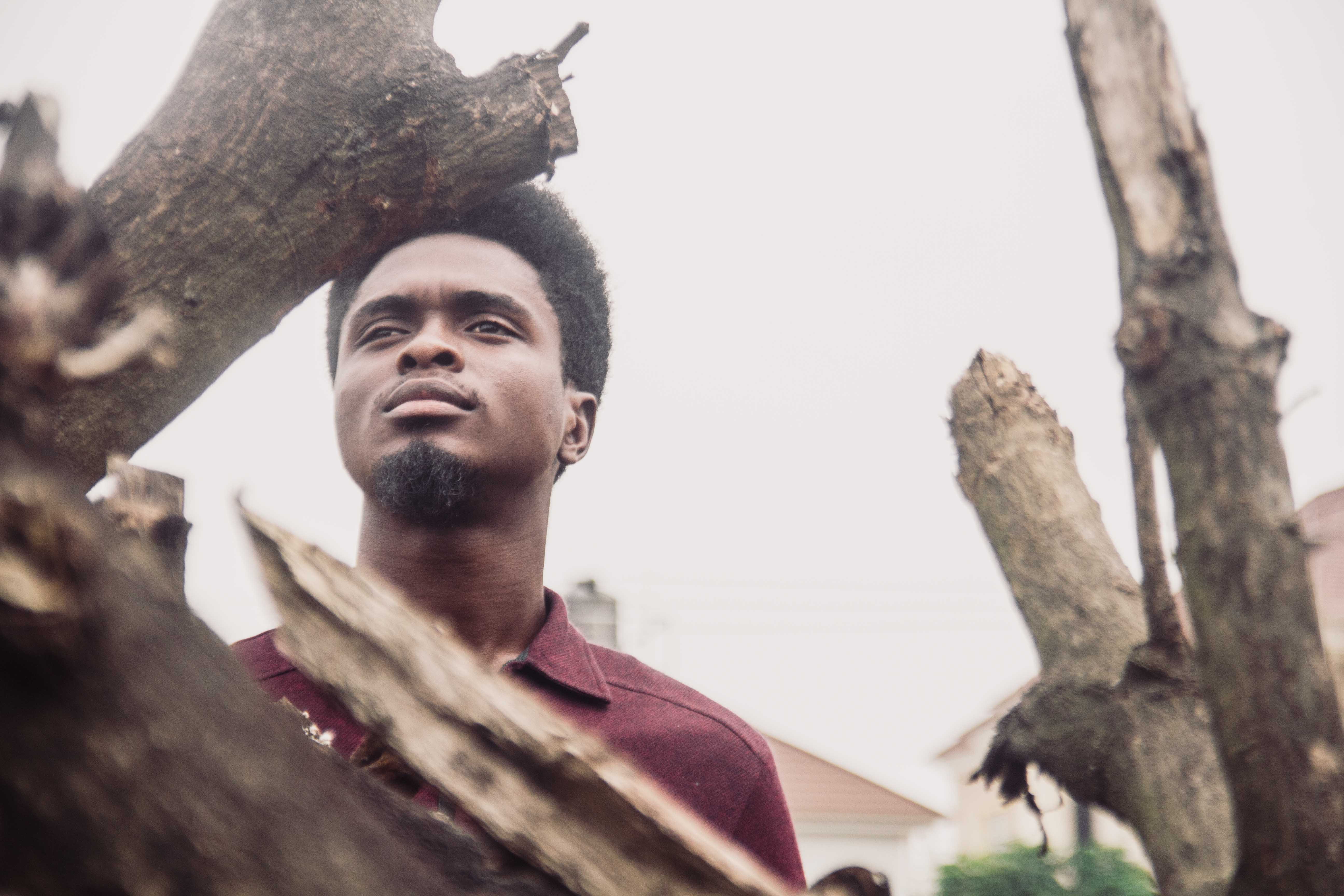 lifestyles, tree, low angle view, portrait, future, day, wood, young men, goatie, young, trunk, real people, plant, nigeria, leisure activity, headshot, HD Wallpaper