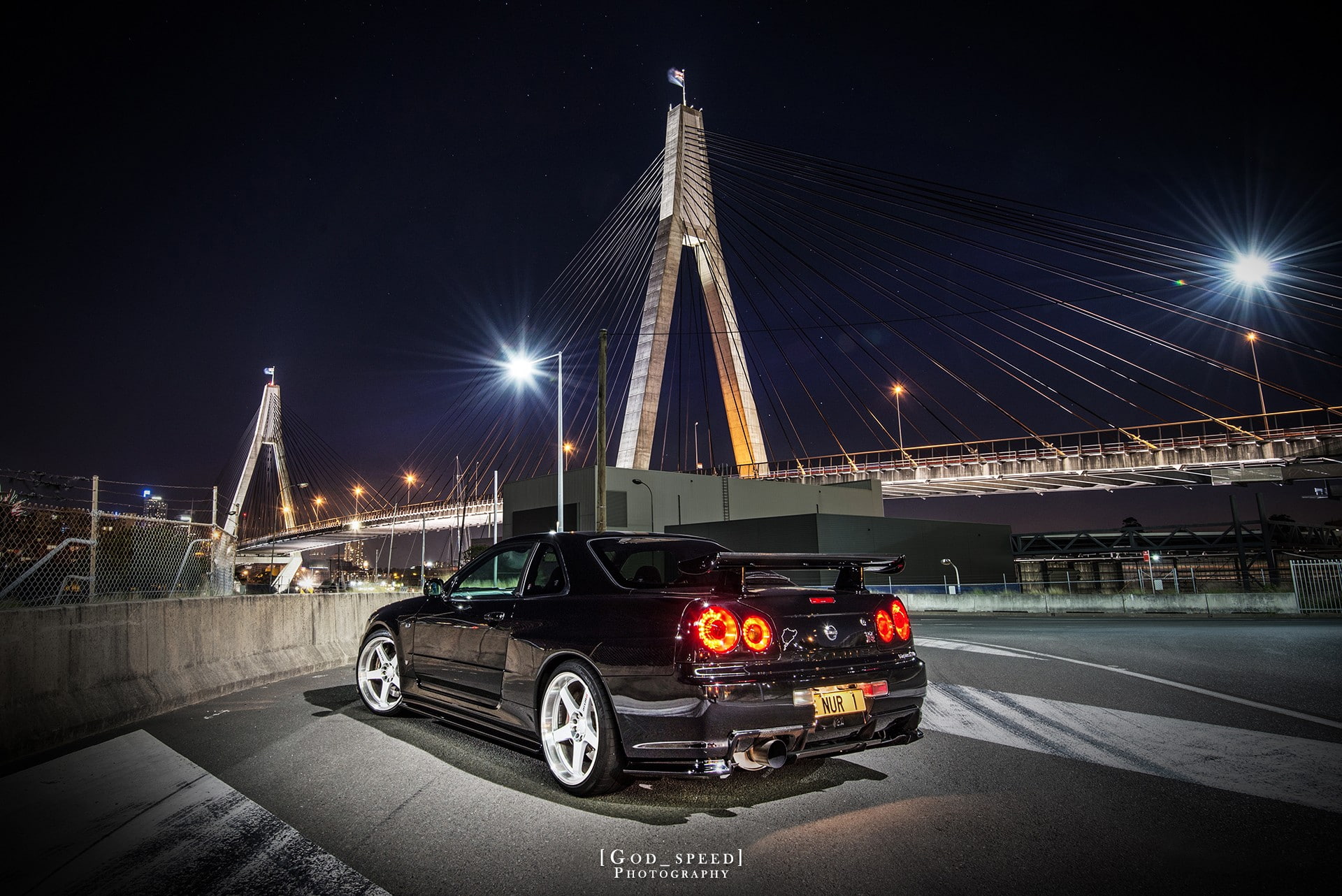 built structure, land vehicle, Nissan, street, motion, lens flare, travel destinations, black cars, connection, outdoors, transportation, night, bridge, HD Wallpaper