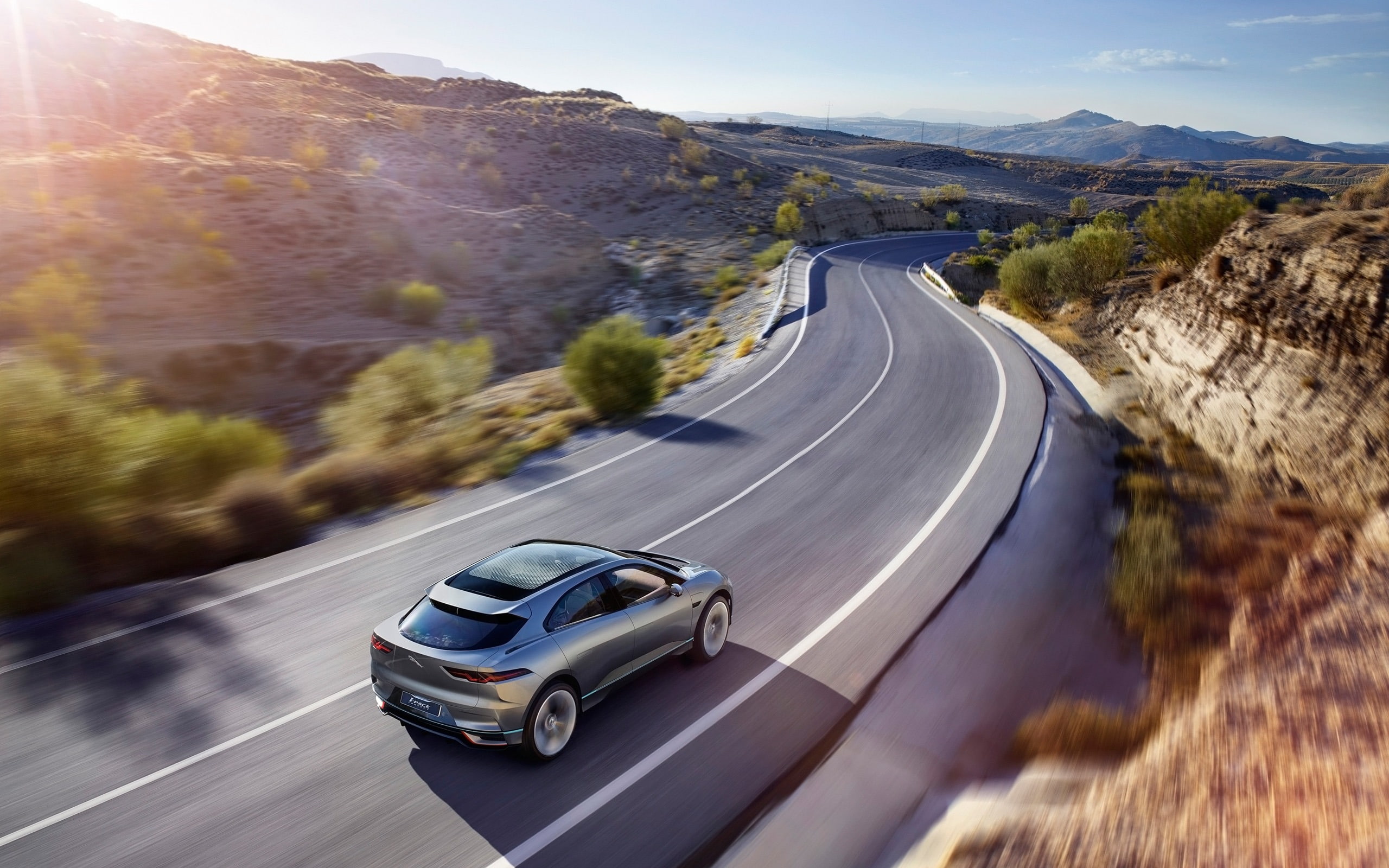 blurred motion, sunlight, motion, on the move, pace, jaguar, outdoors, mountain, the way forward, auto, sign, 2K, hd, car, direction, mode of transportation, HD Wallpaper