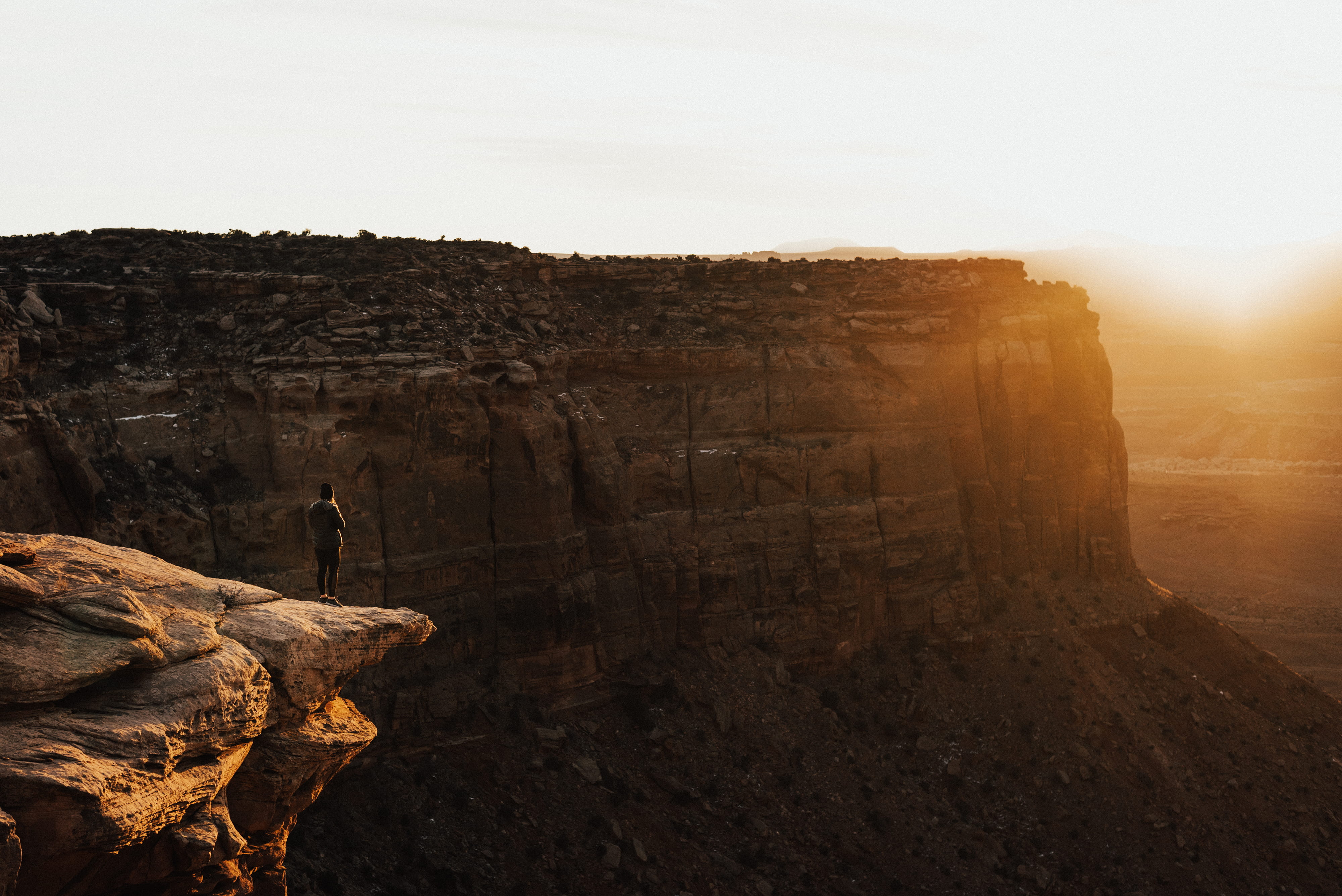 edge, adventure, rock, person, tourism, landscape, history, sunrise, sky, 4K, standing, old ruin, sun, no people, rock formation, the past, ruined, travel, HD Wallpaper