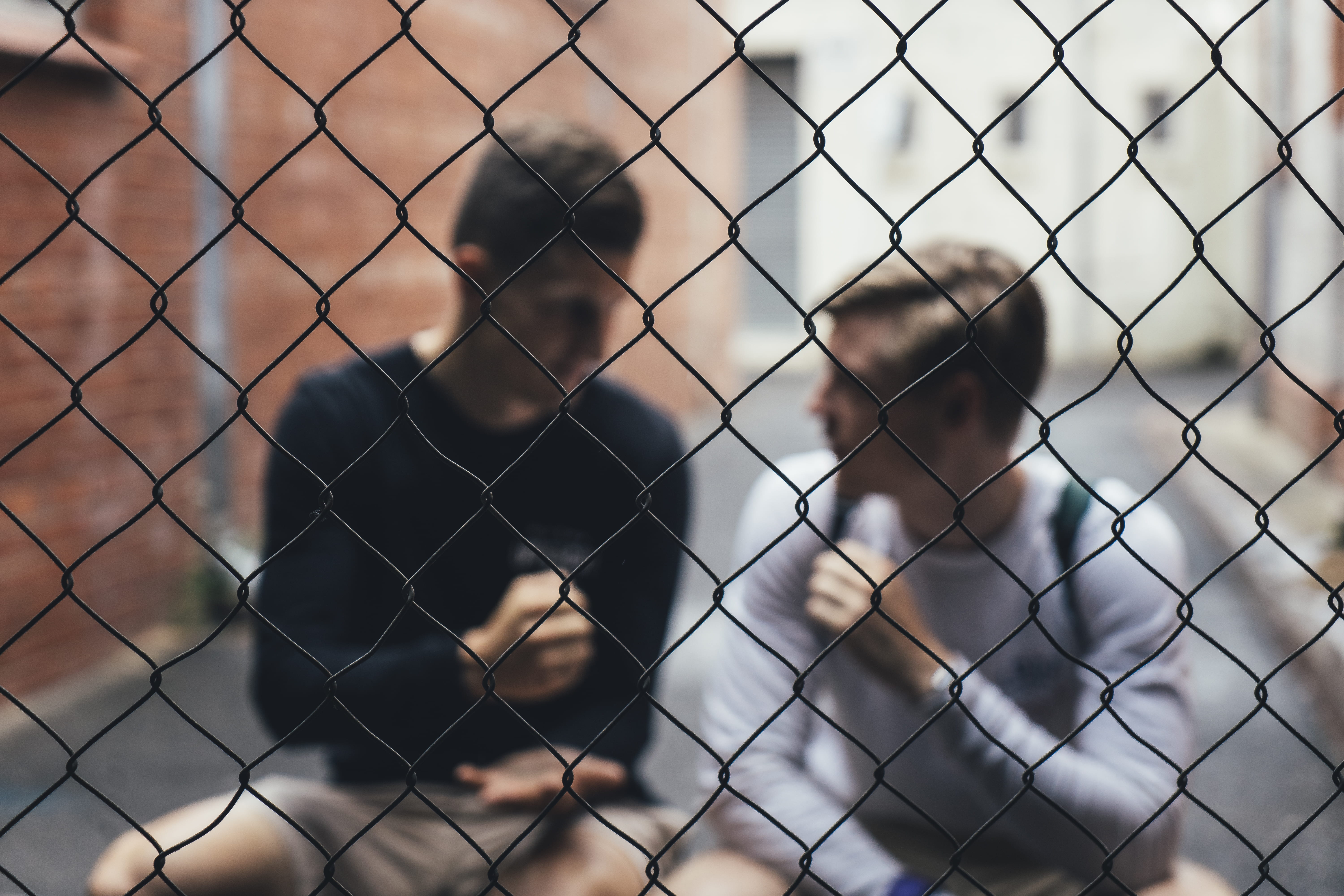barrier, chainlink fence, building exterior, security, two, pattern, safety, fence, talking, gray, architecture, backgrounds, 5K, close-up, defocused, HD Wallpaper