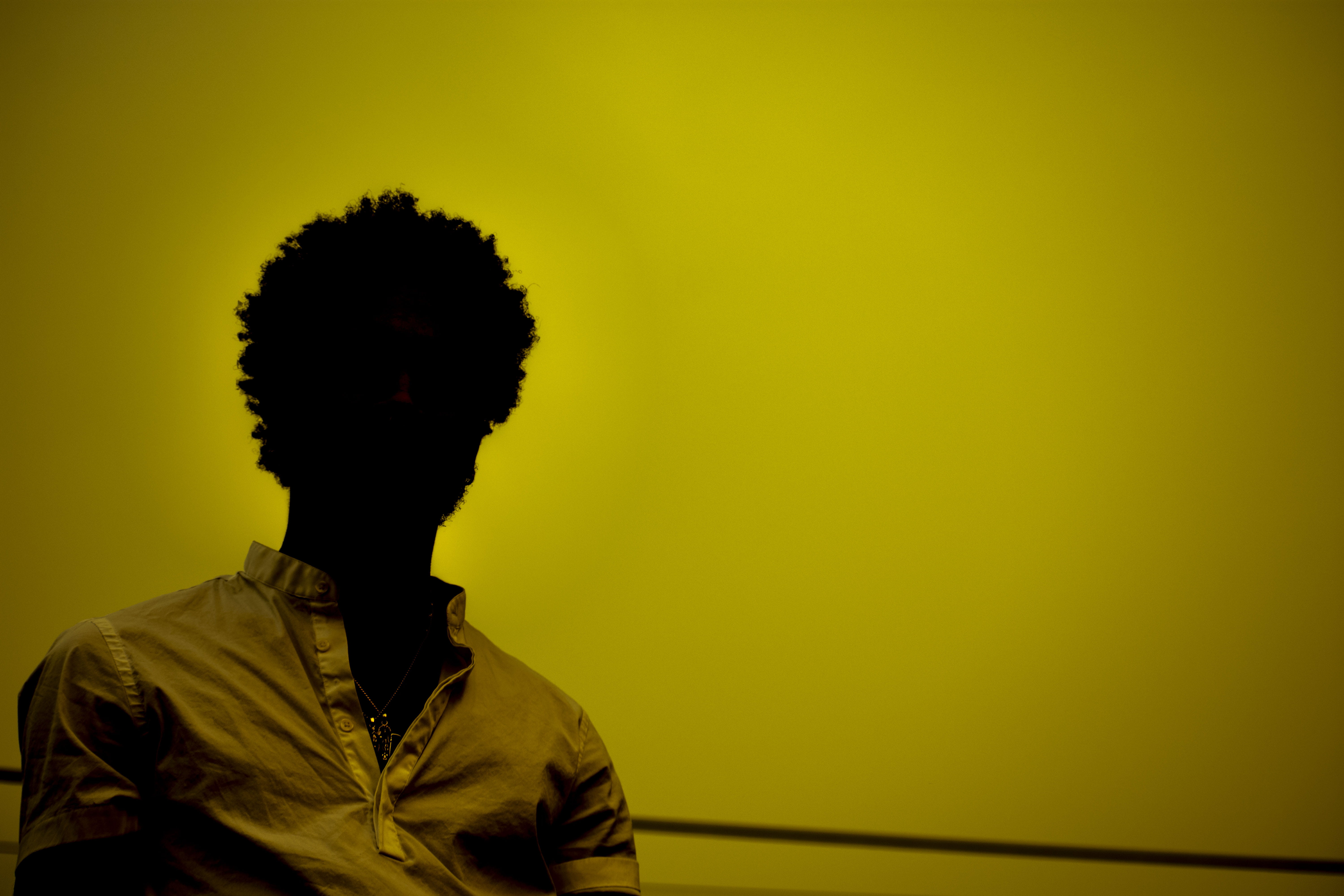 front view, yella, 5K, colored background, leisure activity, yellow, one person, real people, young adult, lexscope, headshot, lifestyles, obscured face, HD Wallpaper