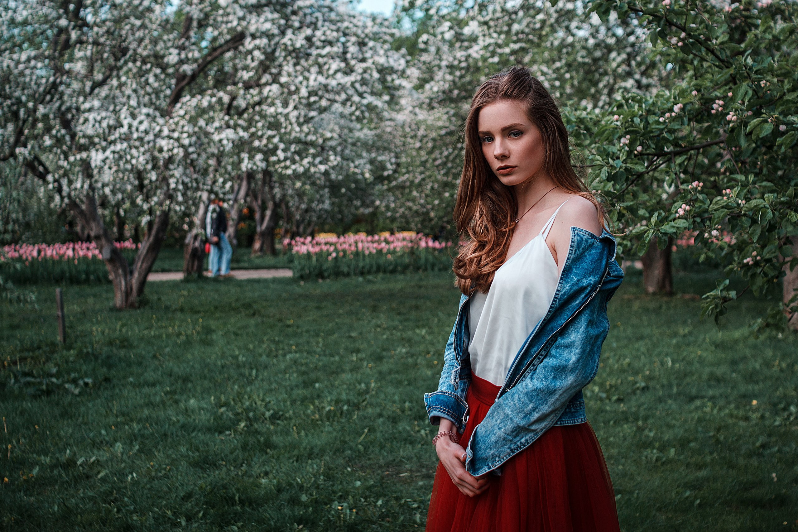 lifestyles, looking at viewer, jeans jacket, leisure activity, teenager, skirt, outdoors, portrait, beautiful woman, grass, hairstyle, brunette, red skirt, HD Wallpaper