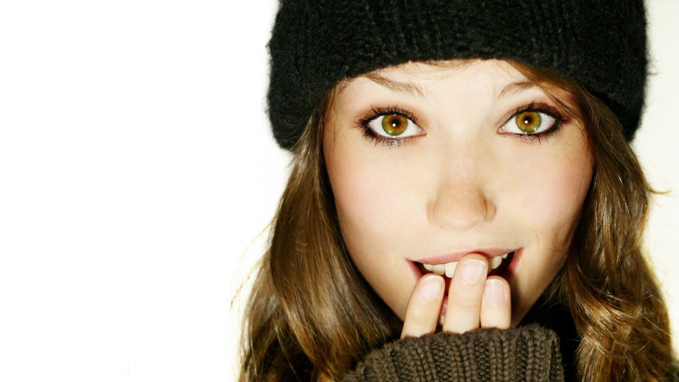 brunette, green eyes, 720P, finger on lips, simple background, knit hat, women, HD Wallpaper