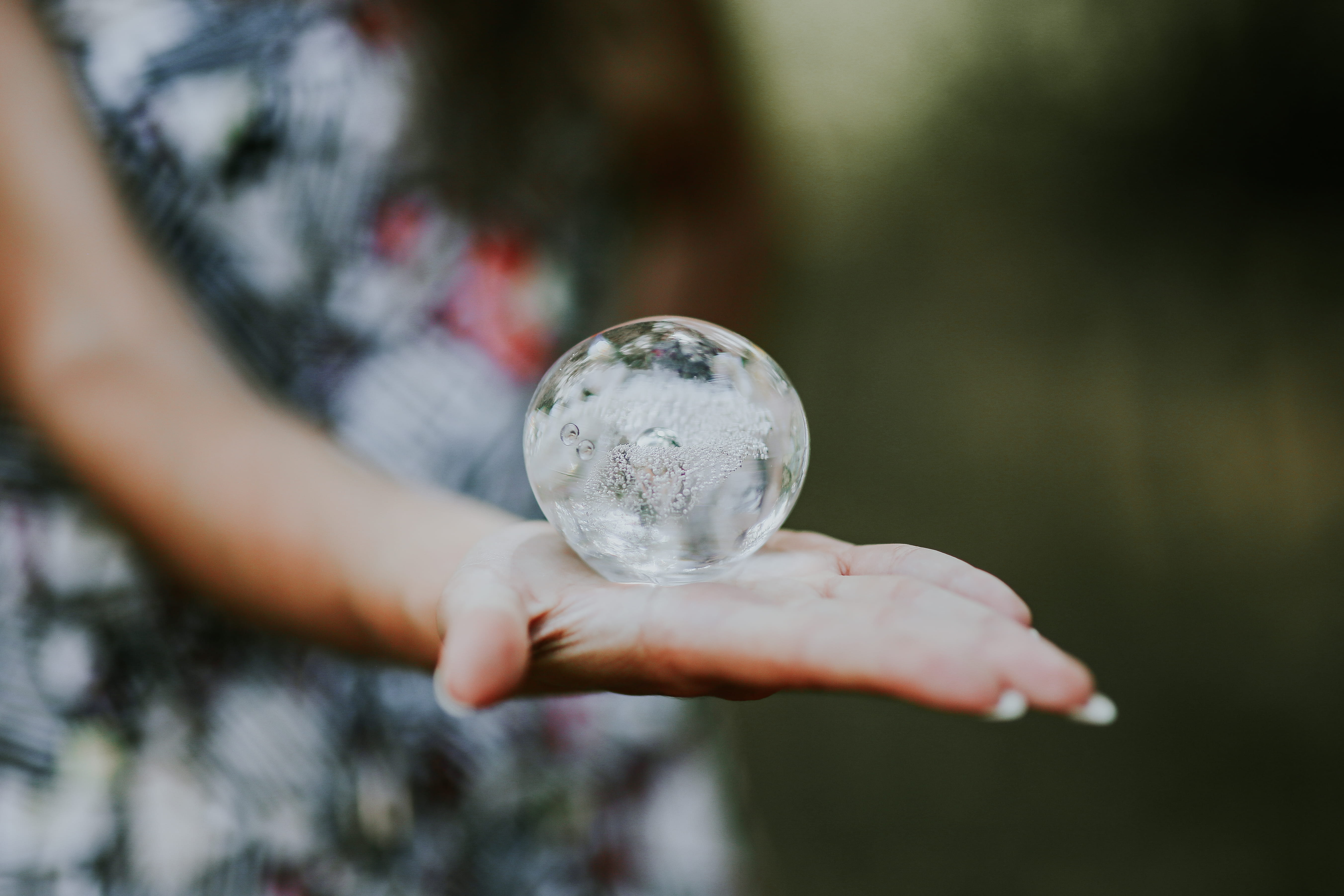 environment, focus on foreground, sphere, one person, outdoors, water, human Hand, little crystal, people, human body part, femine, glass building, human limb, HD Wallpaper