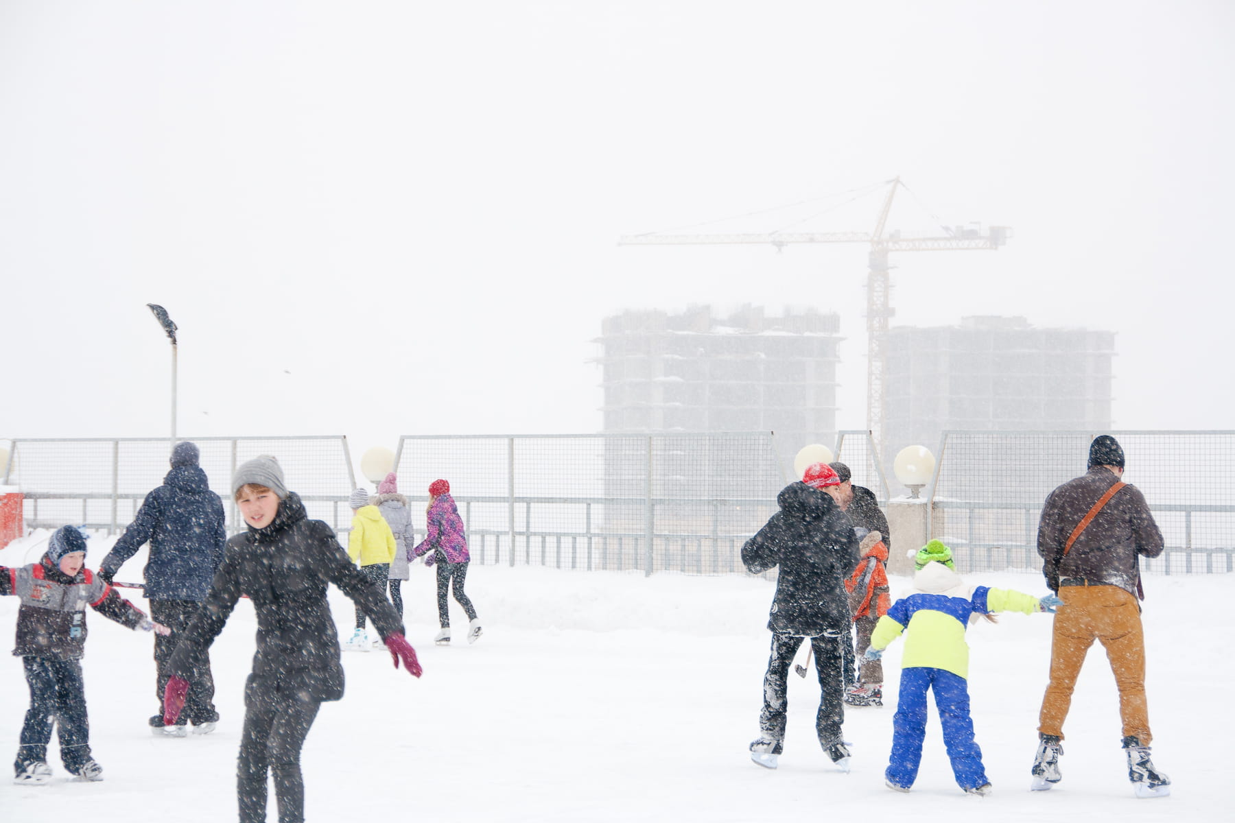 snowing, active, young adult, real people, ice-skating, day, cold temperature, building exterior, kid, skater, young, built structure, architecture, cold, HD Wallpaper