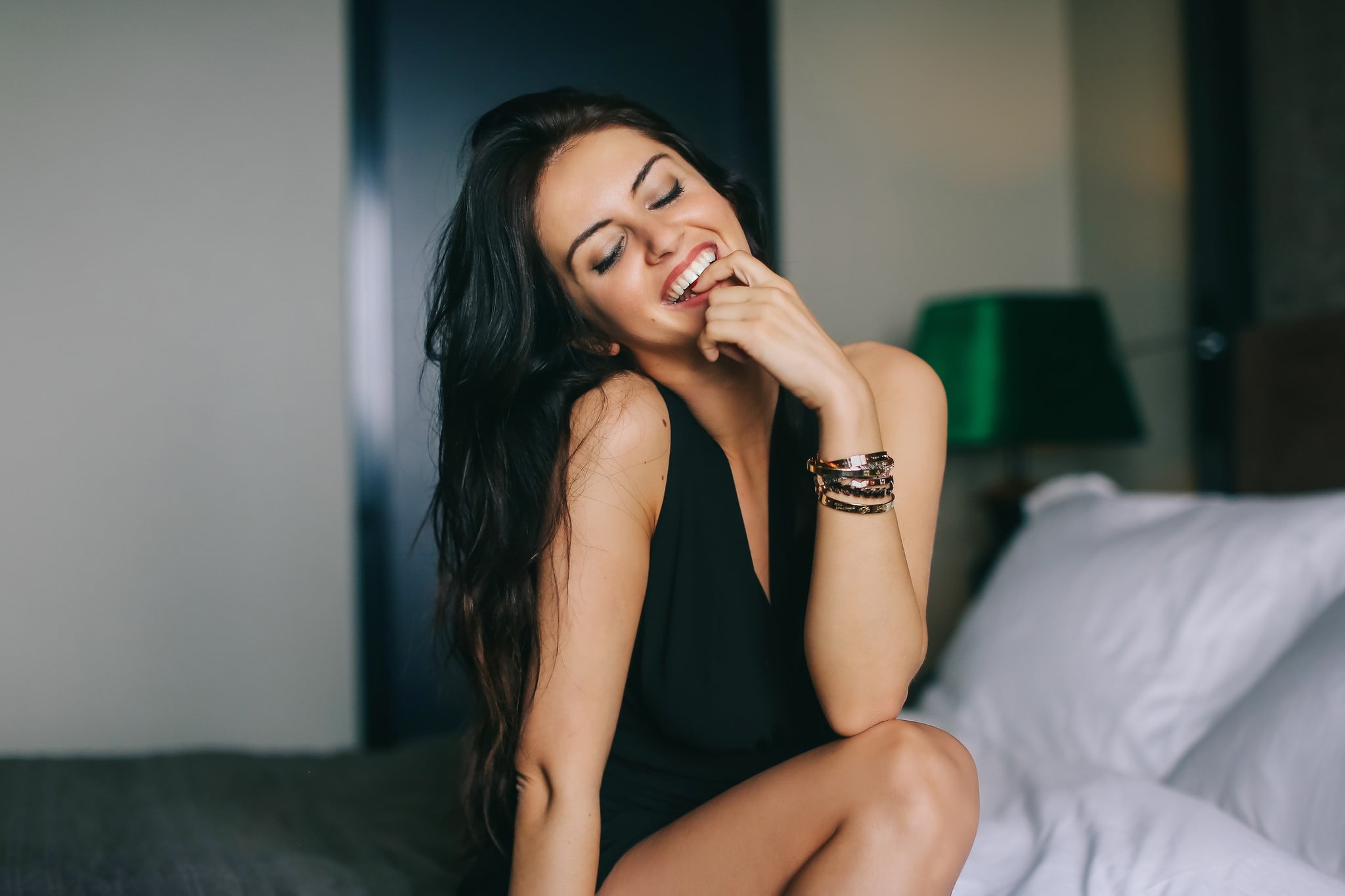 hair, adult, front view, long hair, home interior, domestic room, young adult, bed, women, Aurela Skandaj, 1080P, real people, smiling, finger in mouth, HD Wallpaper