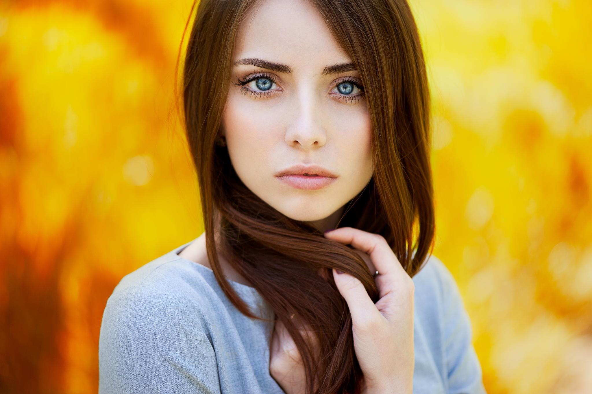 yellow, blurred, brunette, blue eyes, closeup, hands, long hair, portrait, model, face, women, auburn hair, looking at viewer, Natalya, 1080P, hands in hair, HD Wallpaper