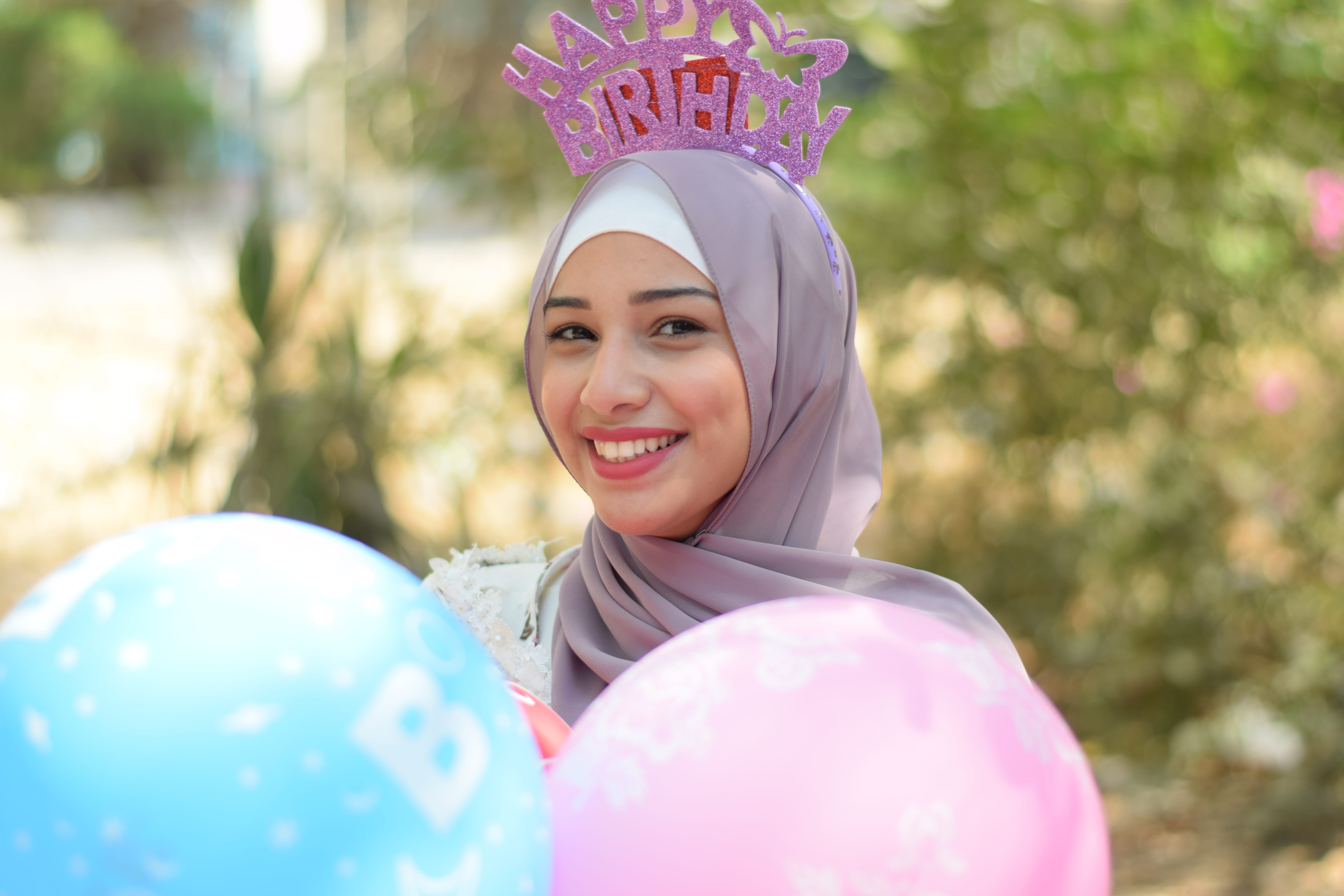 holding, focus on foreground, holiday, outdoors, headscarf, girl, one person, looking at camera, birthday, front view, pink color, enjoyment, joy, teenager, HD Wallpaper