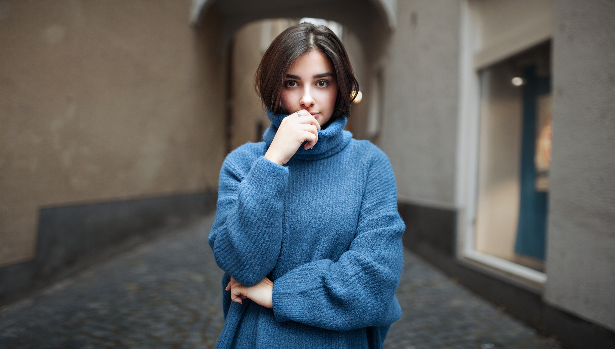 leisure activity, young women, depth of field, blue sweater, casual clothing, clothing, looking at viewer, warm clothing, standing, finger on lips, model, HD Wallpaper