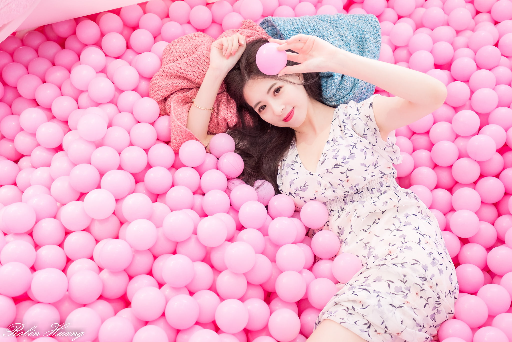 balls, hairstyle, 1080P, dress, looking at camera, women, clothing, brunette, model, smiling, lifestyles, beautiful woman, indoors, young adult, lying on back, HD Wallpaper