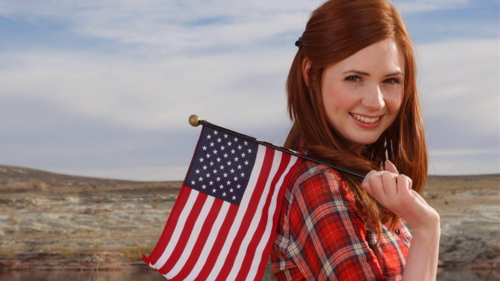 long hair, flag, outdoors, redhead, portrait, smiling, looking over shoulder, wind, emotion, beauty, cloud - sky, sky, Karen Gillan, brown hair, young women, HD Wallpaper